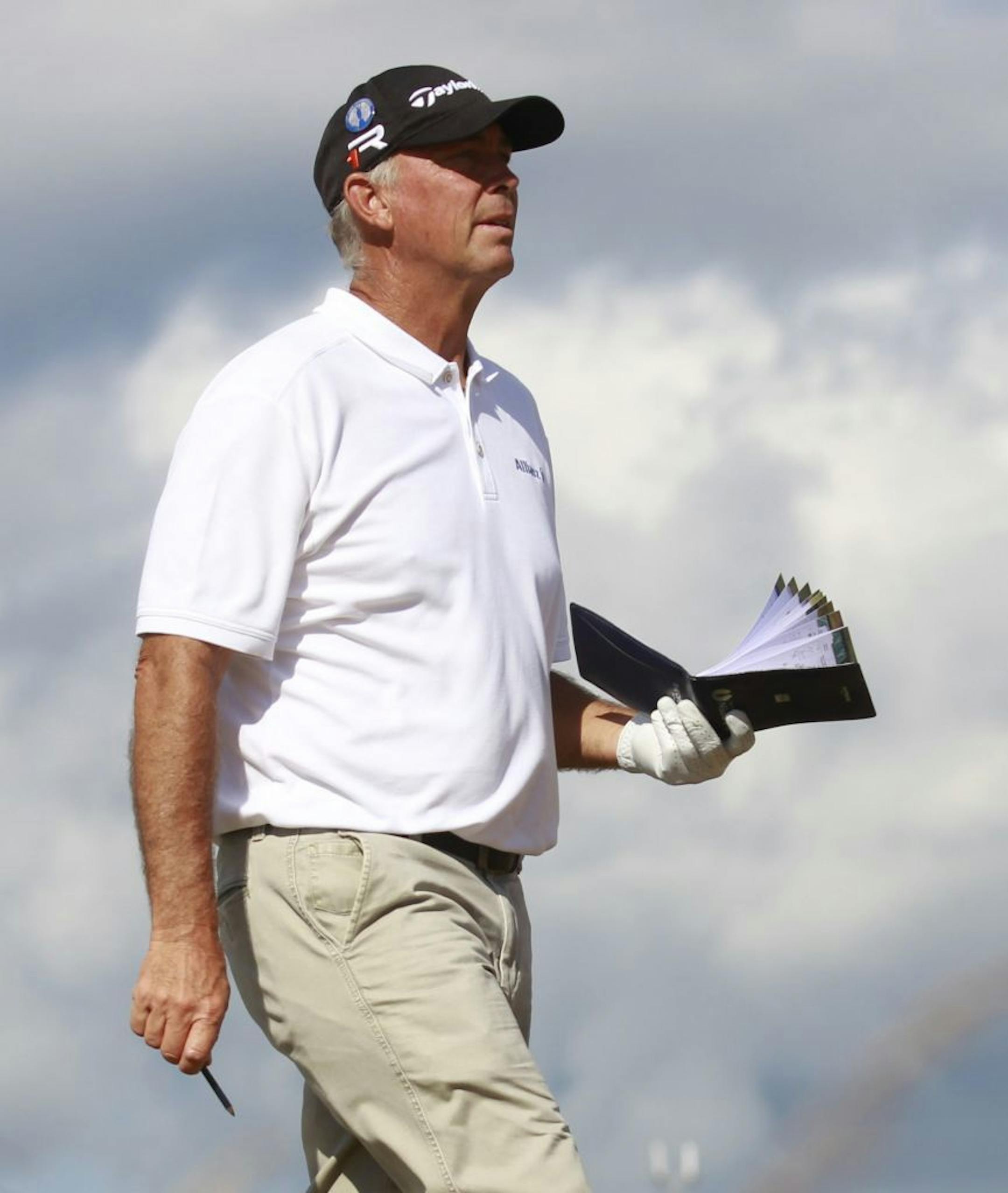 Tom Lehman of the United States looks along the 18th fairway during the first round of the British Open Golf Championship at Muirfield, Scotland, Thursday July 18, 2013.