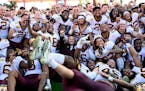The Minnesota Gophers posed for their team photo after defating the Auburn Tigers in the Outback Bowl Wednesday.