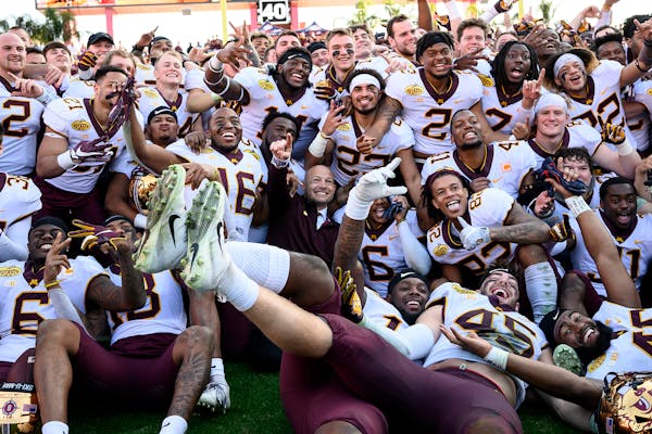 The Minnesota Gophers posed for their team photo after defating the Auburn Tigers in the Outback Bowl Wednesday.
