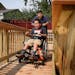 Marshall Wanstall, 8, who has cerebral palsy and uses a wheelchair, got the chance to try out his new wheelchair ramp, built by volunteers from Rebuil