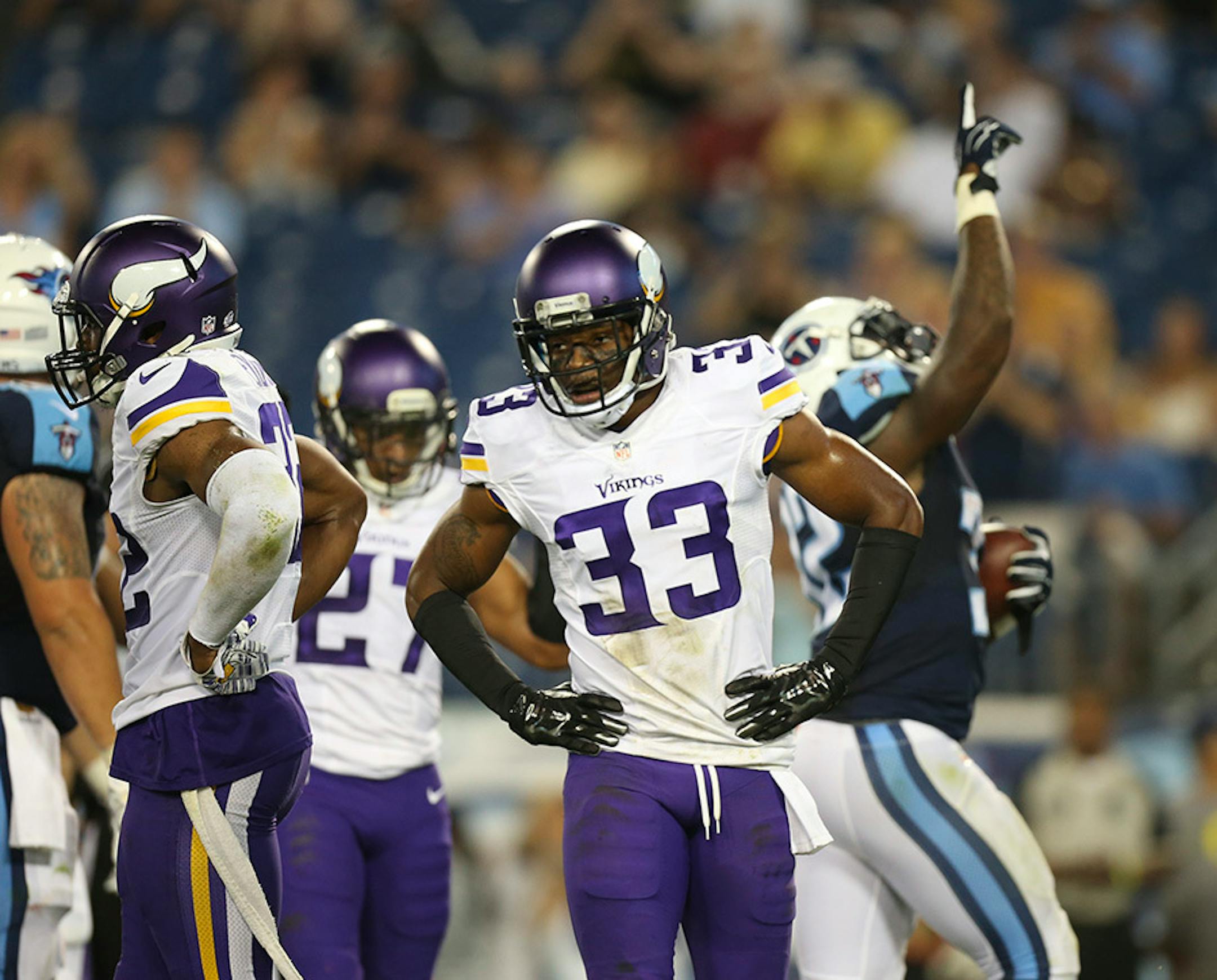 Vikings defensive back Josh Thomas (33) reacted as Tennessee Titans defensive back Brandon Harris (32) celebrated his one yard touchdown reception in the fourth quarter Thursday night.