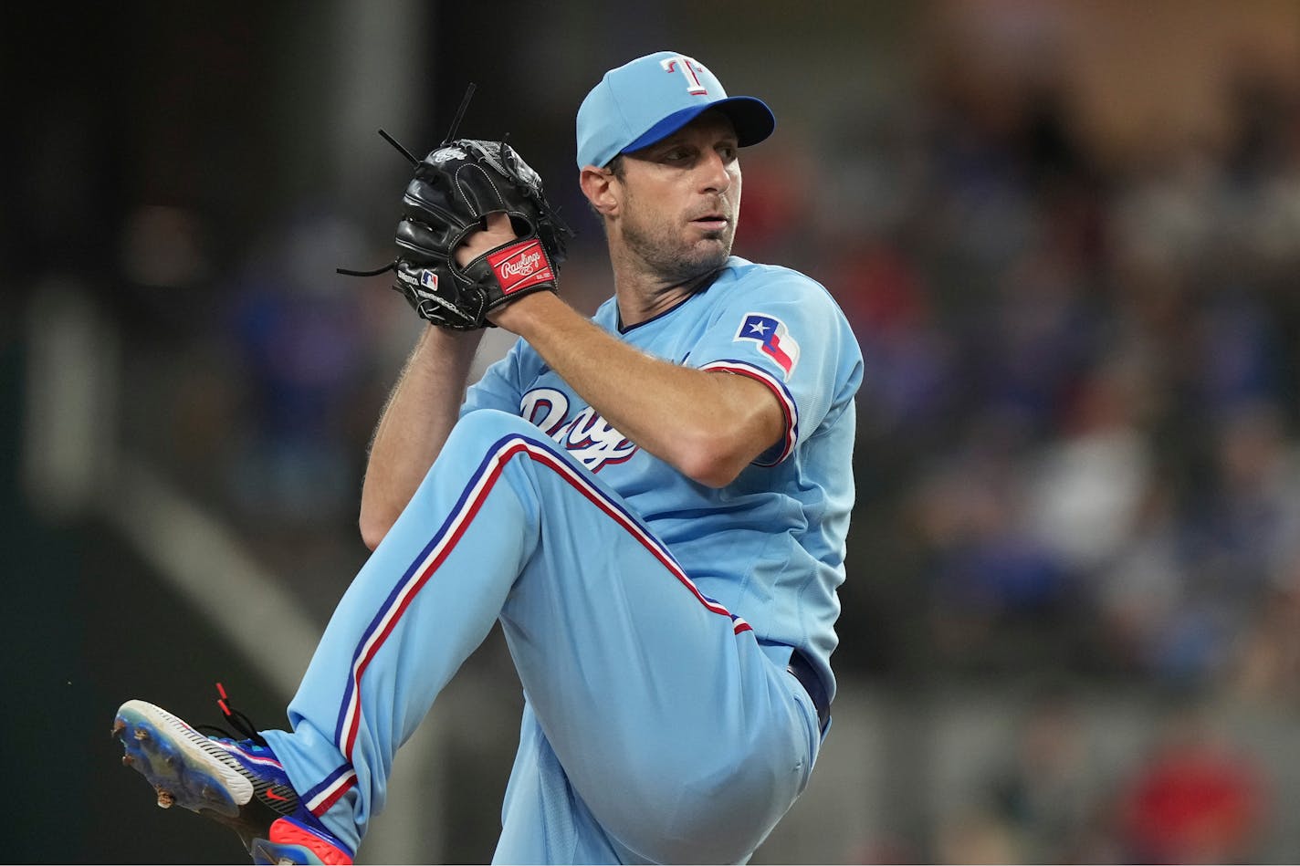 Texas Rangers starting pitcher Max Scherzer throws during the first inning of a baseball game against the Milwaukee Brewers in Arlington, Texas, Sunday, Aug. 20, 2023. (AP Photo/LM Otero)