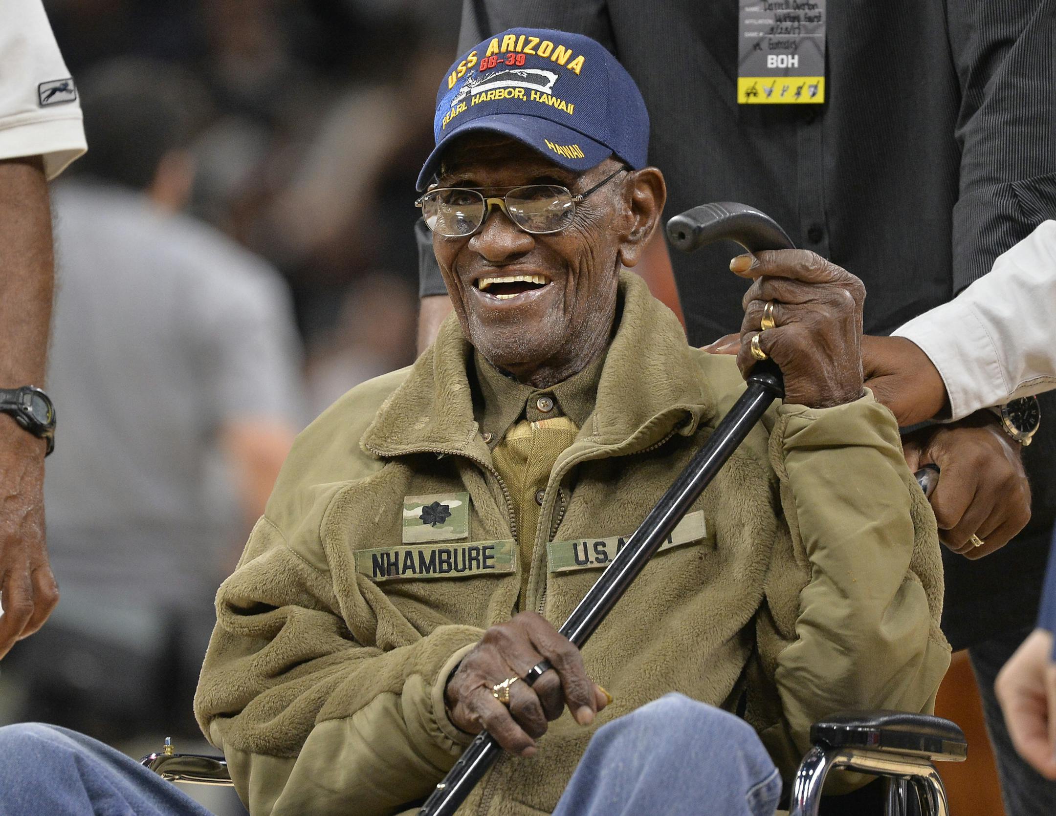 FILE - In this March 23, 2017, file photo, Richard Overton leaves the court after a special presentation honoring him as the oldest living American war veteran, during a timeout in an NBA basketball game between the Memphis Grizzlies and the San Antonio Spurs. The family of Richard Overton says Social Security and banking account numbers for the 112-year-old Austin man were used to make seven withdrawals over the past several months. Cousin Volma Overton declined to say how much was stolen but s