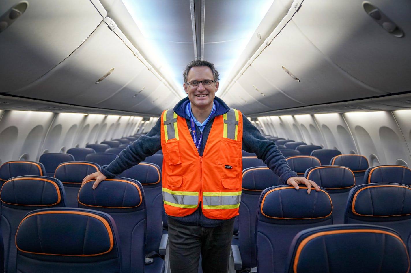 Sun Country Airlines CEO Jude Bricker aboard one of the airlines' newly painted airplanes, a 183 seat 737-800.