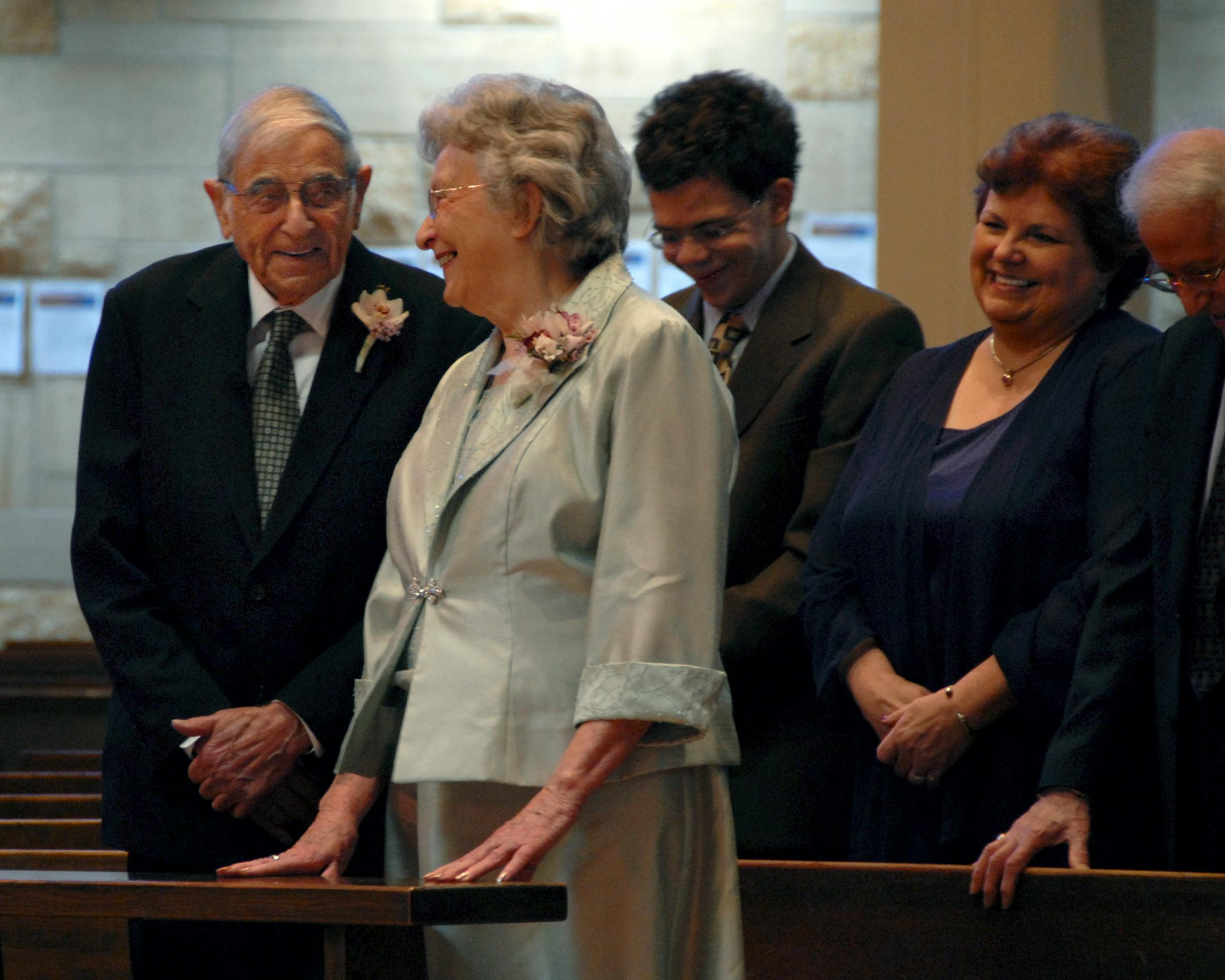 Vernon Braun smiled at his beaming bride-to-be, Rita Miskimen. His grandson and daughter, Matt and Linda Pollari, stood behind them.