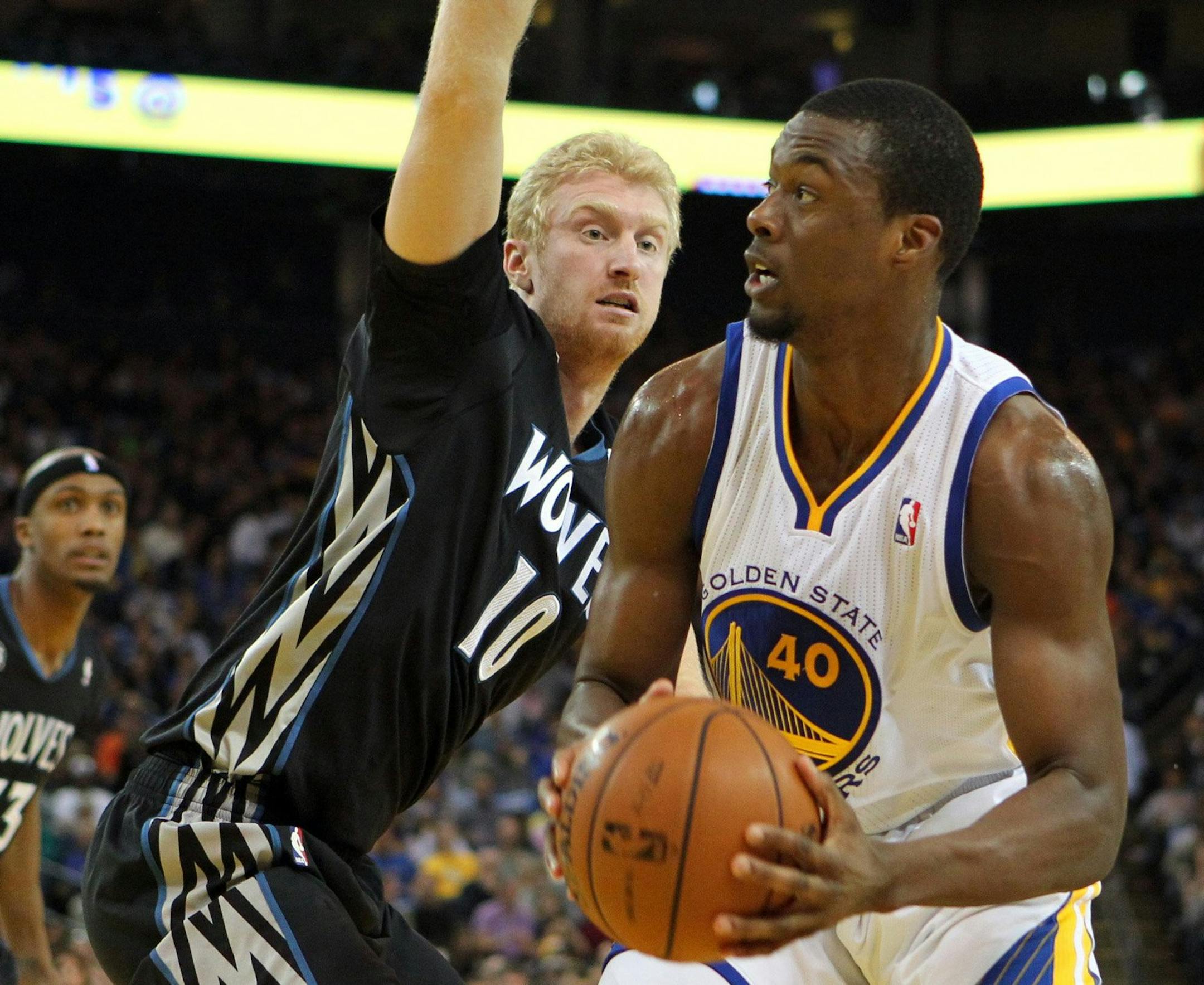 The Golden State Warriors' Harrison Barnes (40) is pressured by the Minnesota Timberwolves' Chase Budinger (10) in the first half at the Oracle Arena in Oakland, Calif., on Friday, Jan. 24, 2014. (Ray Chavez/Bay Area New Group/MCT)