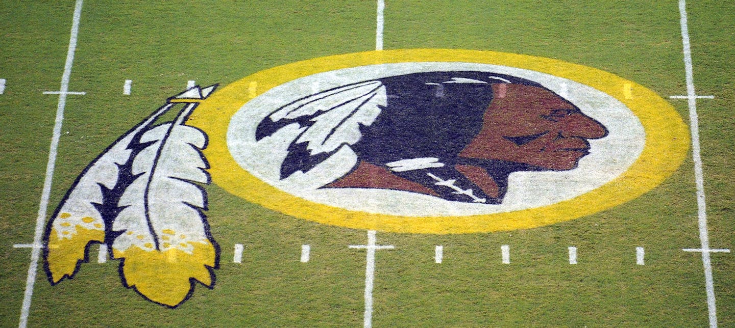 The Washington Redskins logo is shown on the field before the start of a preseason NFL football game against the New England Patriots, Friday, Aug. 28, 2009, in Landover, Md. (AP Photo/Nick Wass) ORG XMIT: NYOTK ORG XMIT: MIN1311051039317727