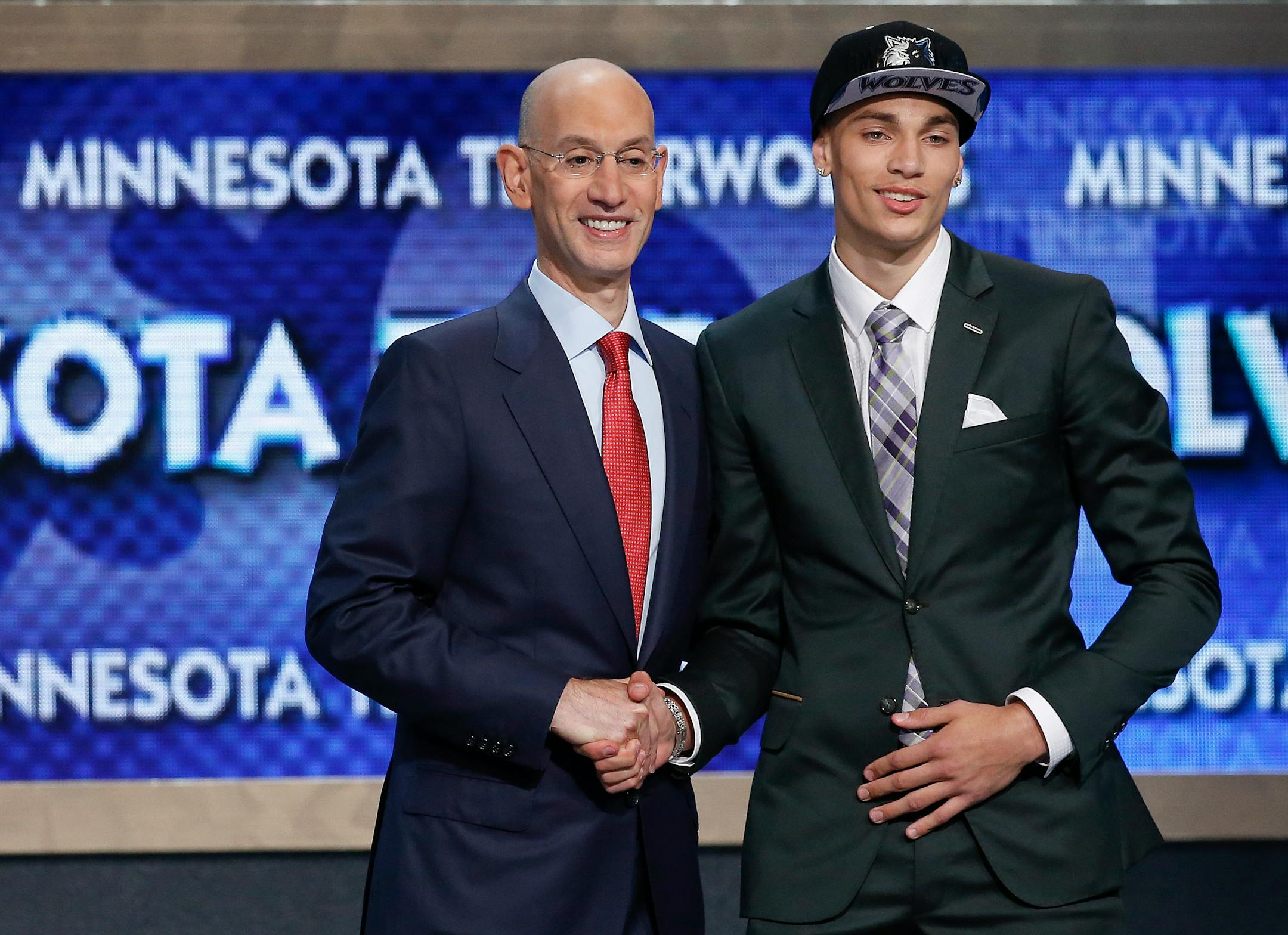 Zach LaVine, shown with NBA Commissioner Adam Silver on Thursday, comes to the Timberwolves from UCLA, and his college coach said he should turn to another UCLA product, Wolves forward Kevin Love, for advice as he tries to make his way in the NBA.