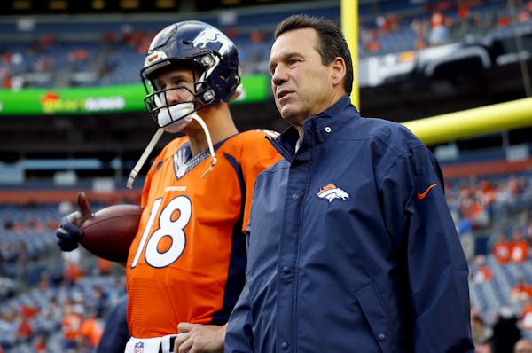 FILE - In this Sept. 3, 2015, file photo, Denver Broncos quarterback Peyton Manning (18) talks with head coach Gary Kubiak prior to an NFL preseason f
