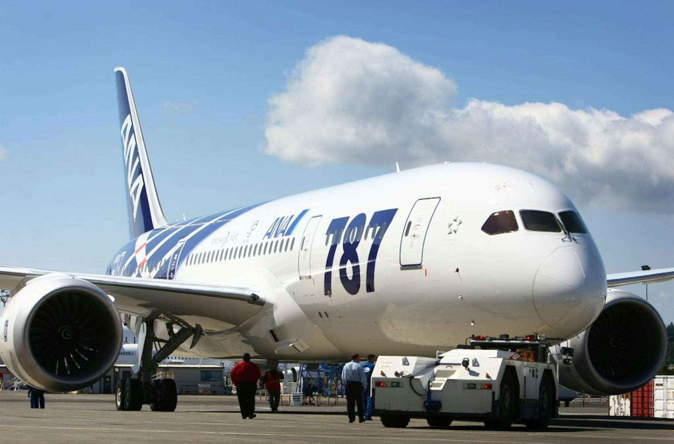 A Boeing 787 is rolled out of the paint hangar during the reveal of the first 787 destined for use by launch customer All Nippon Airways. The 787 livery and interior were unveiled at the Boeing plant in Everett, Wash. on Saturday, August 6, 2011. The 787 is Boeing's new composite wide-body airliner. The first plane should be delivered to ANA by the end of September.