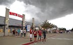 Storms roll into the area, delaying the start of an MLS soccer match between Minnesota United and FC Dallas in Frisco, Texas, Saturday, Aug. 18, 2018.