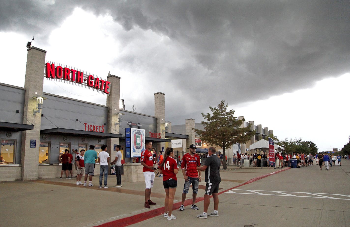 Storms roll into the area, delaying the start of an MLS soccer match between Minnesota United and FC Dallas in Frisco, Texas, Saturday, Aug. 18, 2018. (Stewart F. House/The Dallas Morning News via AP)