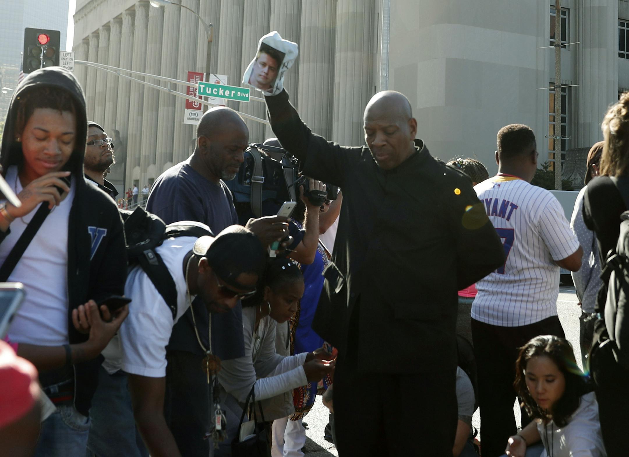 Protesters gather outside of the courthouse, Friday, Sept. 15, 2017, in downtown St. Louis, after a judge found Jason Stockley, a white former St. Louis police officer, not guilty of first-degree murder in the death of Anthony Lamar Smith, a black man who was fatally shot following a high-speed chase in 2011. (AP Photo/Jeff Roberson)