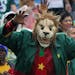 A Cameroon supporter wearing a mask gestures before the start of the group A World Cup soccer match between Mexico and Cameroon in the Arena das Dunas