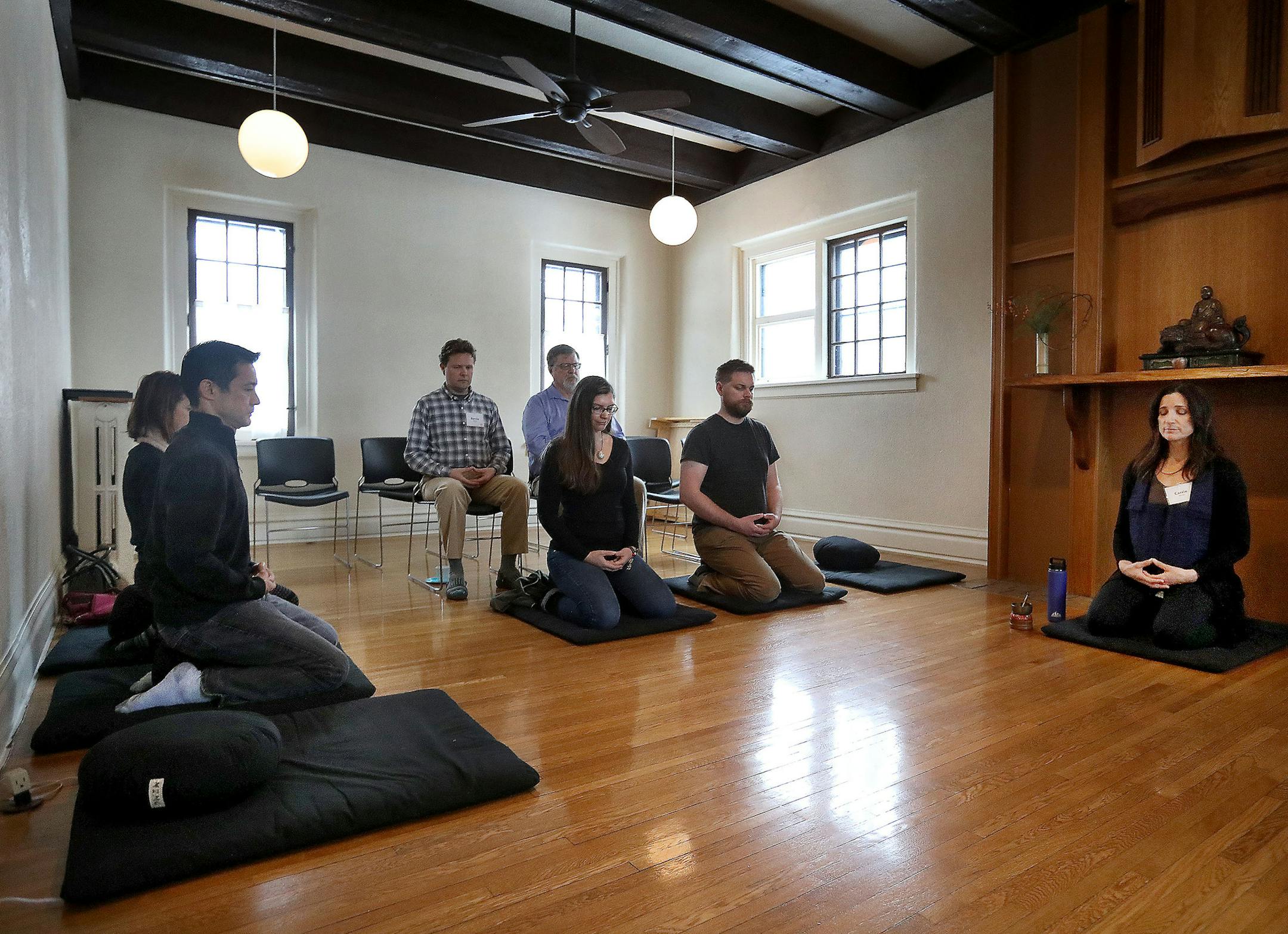Meditation instructor Carri Garcia, right, led practitioners in a meditation and instruction session in the main meditation hall at the Minnesota Zen Meditation Center Friday, Nov. 29, 2019, in Minneapolis, MN. Participants meditated and heard a talk on The Healing Power of Looking at a Blank Wall.] DAVID JOLES • david.joles@startribune.com The Minnesota Zen Center hosted its annual "Blank Friday'' event Nov. 29, a Zen Buddhist response to the frenzy of Black Friday shoppers. There will b
