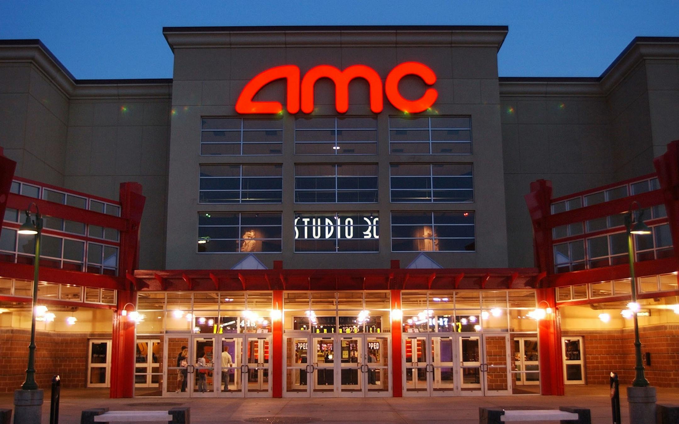 FILE - In this May 11,2005 file photo, people enter AMC's Studio 30 theater in Olathe, Kan. AMC Theatres is buying European movie theater operator Odeon & UCI Cinemas Group in a deal valued at about 921 million pounds ($1.21 billion). AMC says, Tuesday, July 12, 2016, that the transaction will make it the biggest movie theater operator in the world. Odeon & UCI has 242 theaters in Europe. The deal will give AMC a total of 627 theaters in eight countries. (AP Photo/Orlin Wagner) ORG XMIT: NY108