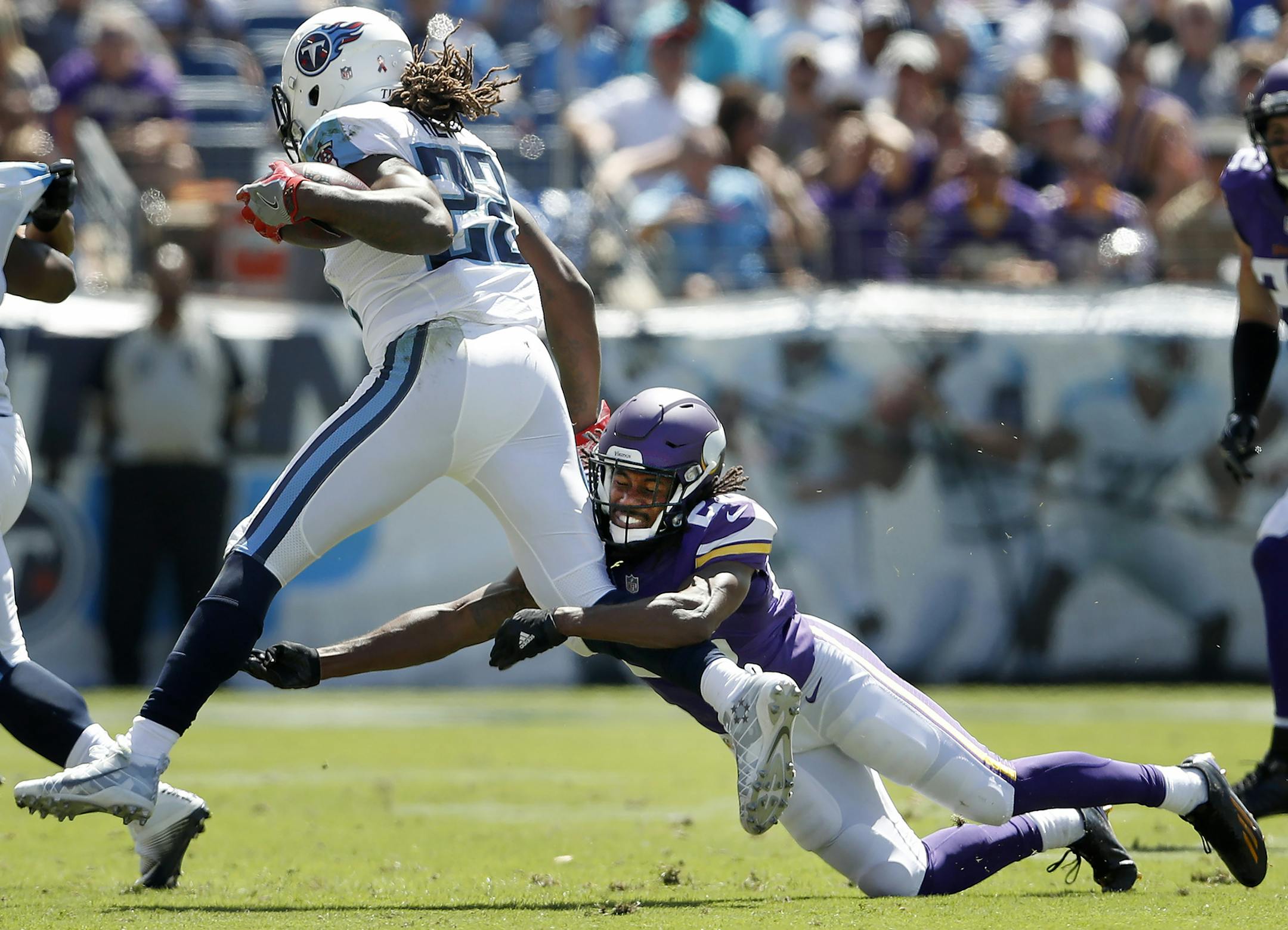 Trae Waynes (26) tackled Derrick Henry (22) for a loos in the second quarter. ] CARLOS GONZALEZ cgonzalez@startribune.com - September 11, 2016, Nashville, TN, Nissan Stadium, NFL, Minnesota Vikings vs. Tennessee Titans