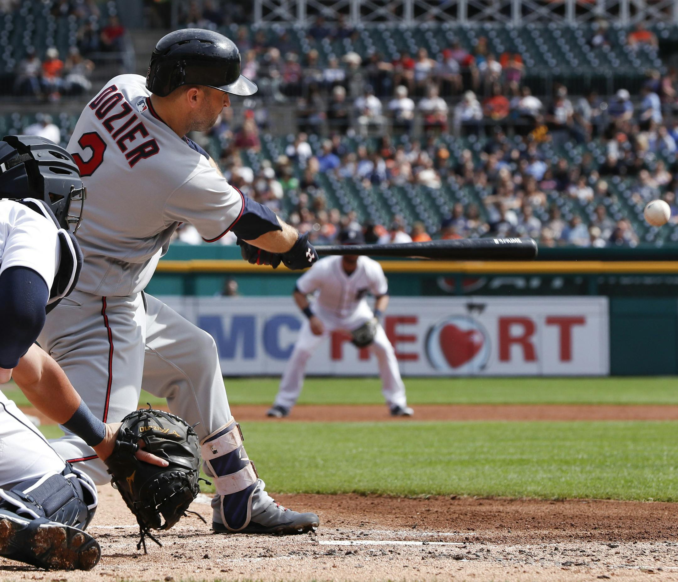Minnesota Twins' Brian Dozier (2) hits a two-run single against the Detroit Tigers in the second inning of a baseball game in Detroit, Thursday, Sept. 15, 2016. (AP Photo/Paul Sancya)