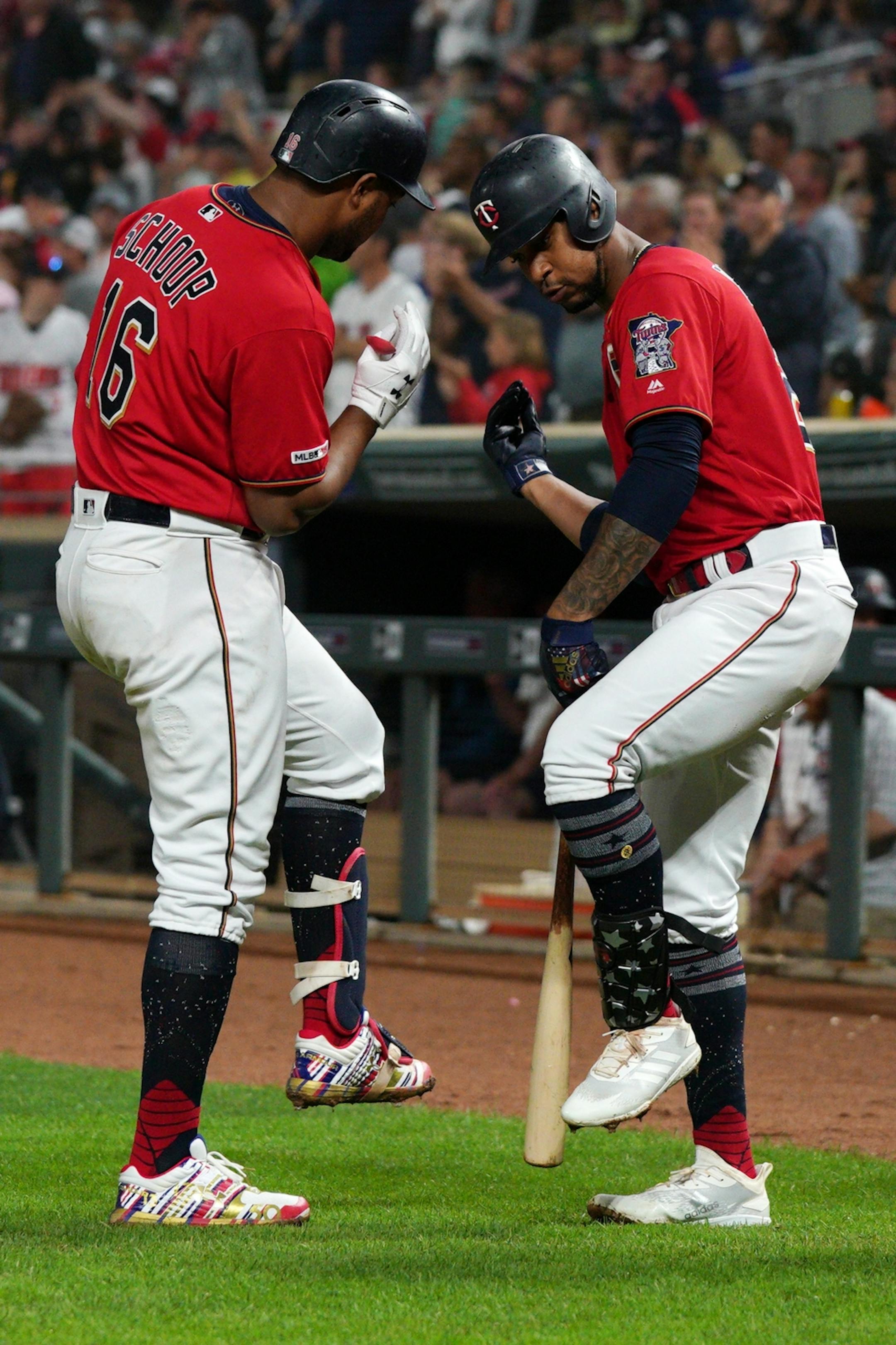 Minnesota Twins second baseman Jonathan Schoop (16) celebrated with Minnesota Twins center fielder Byron Buxton (25) after hitting a two-run home run in the fifth inning.