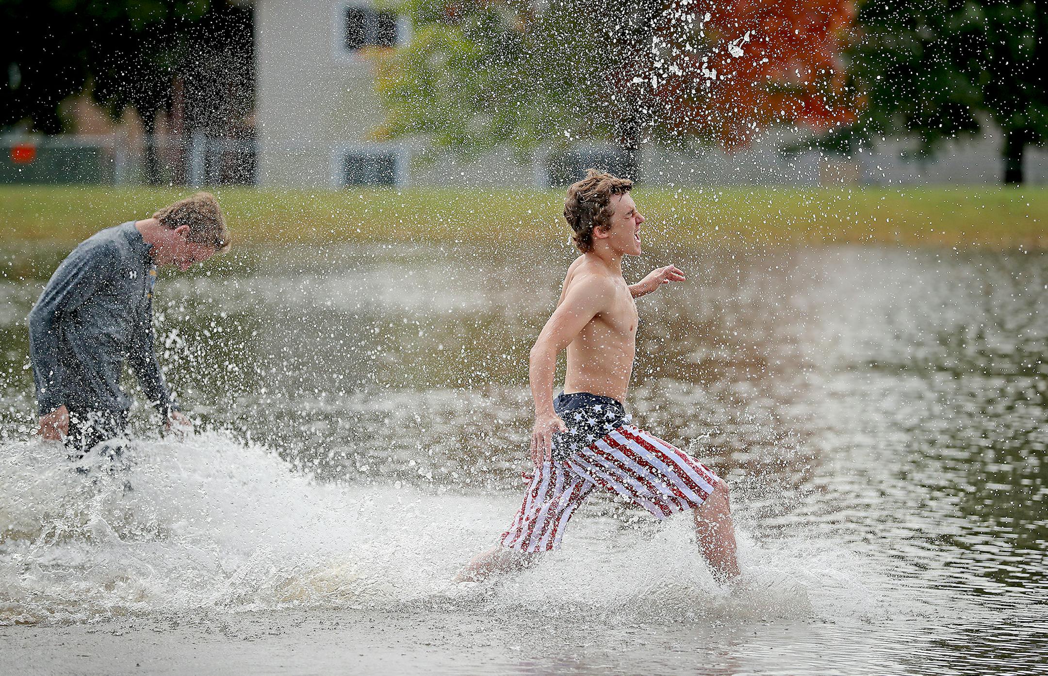 Dayton Deutsch led some of his football teammates to check out the flooding on the football field near the Waseca High School, Thursday, September 22, 2016 in Waseca, MN. ] (ELIZABETH FLORES/STAR TRIBUNE) ELIZABETH FLORES &#x2022; eflores@startribune.com