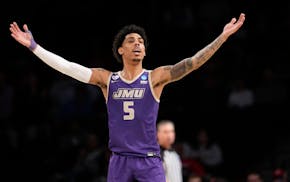 James Madison guard Terrence Edwards Jr. reacts to defeating Wisconsin in the first round of the men's NCAA Tournament, Friday.