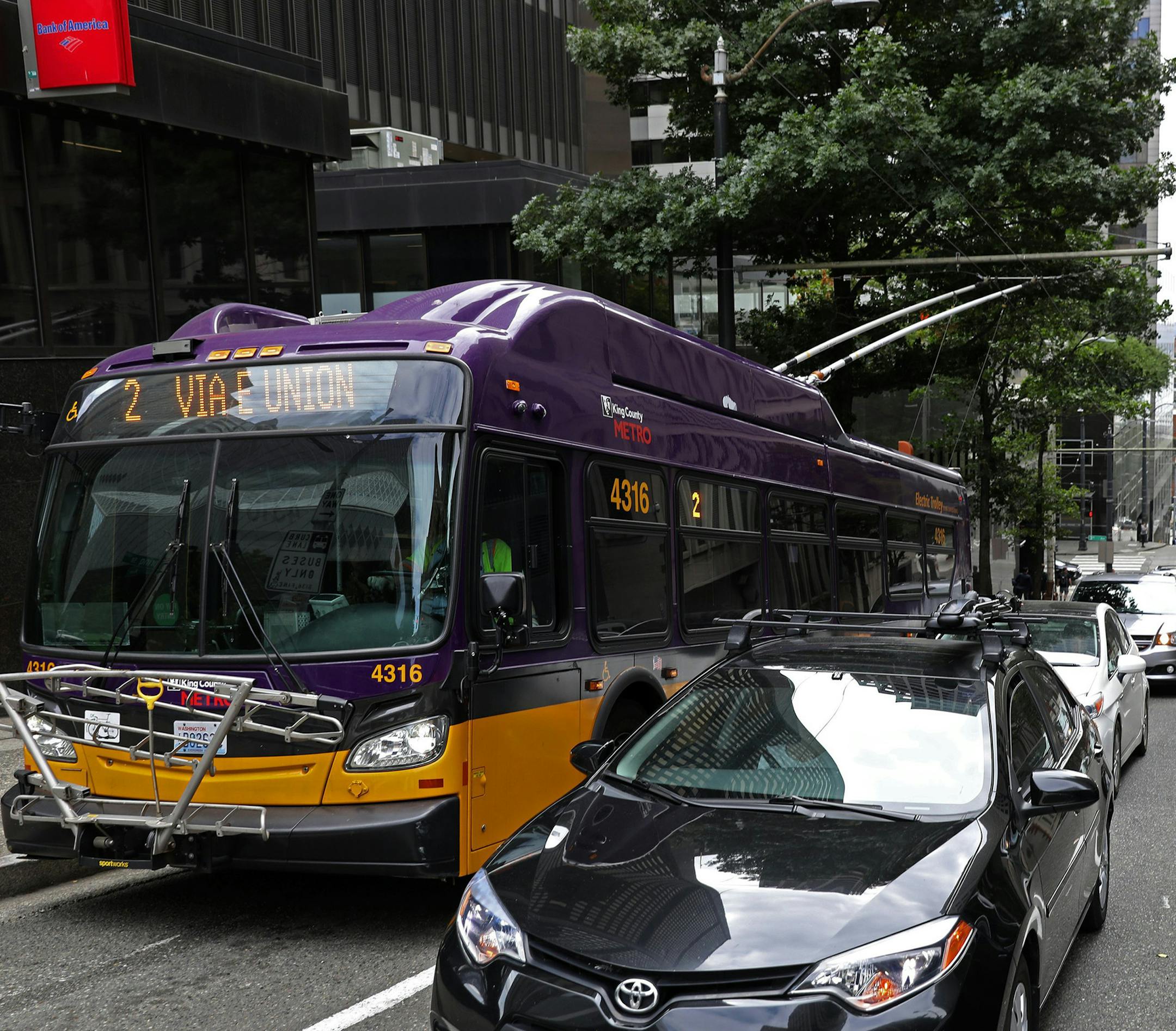 The No. 2 bus comes up Spring Street in downtown Seattle. the city of Seattle will require many businesses to offer workers the opportunity to pay for their transit commutes with pretax wages. (Ken Lambert/The Seattle Times/TNS)