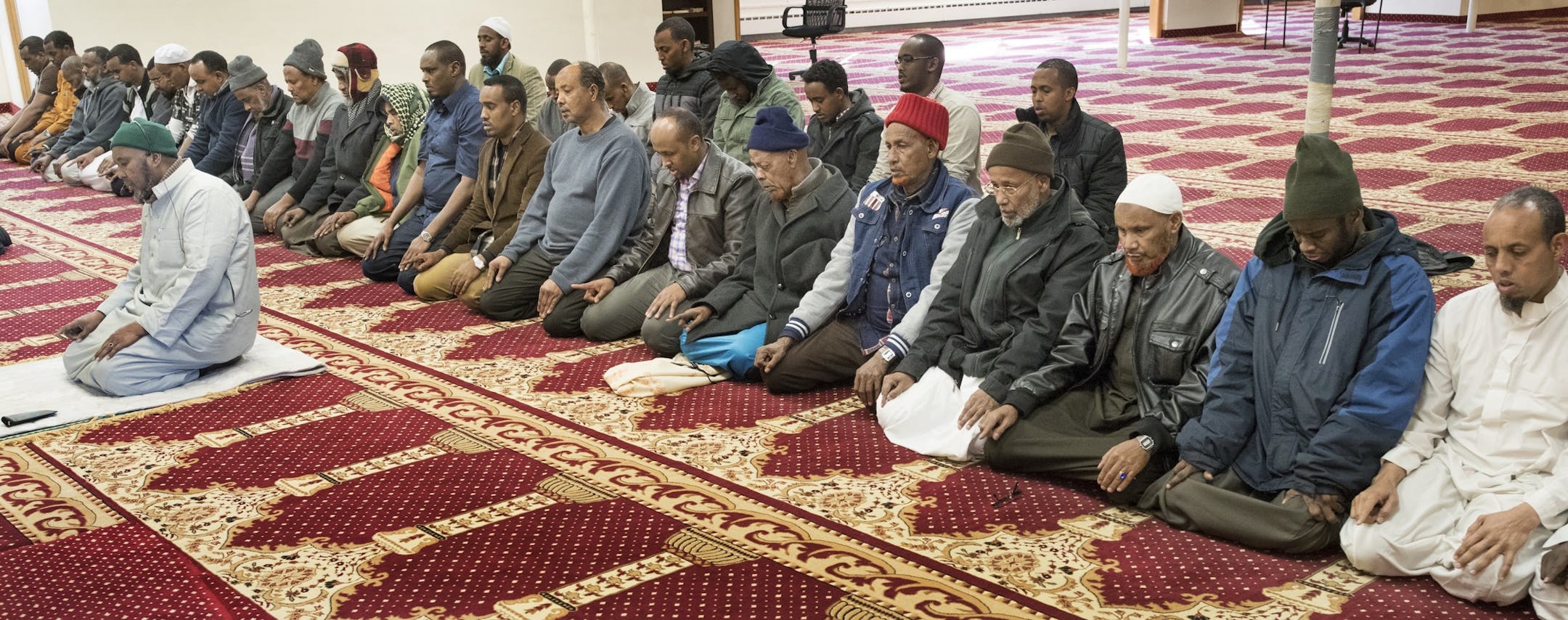 Imam Hirsi Hussein leads a group of men in prayer at Abubakar As-Sadique Islamic Center Wednesday Feb 1, 2017 in Faribault, MN.