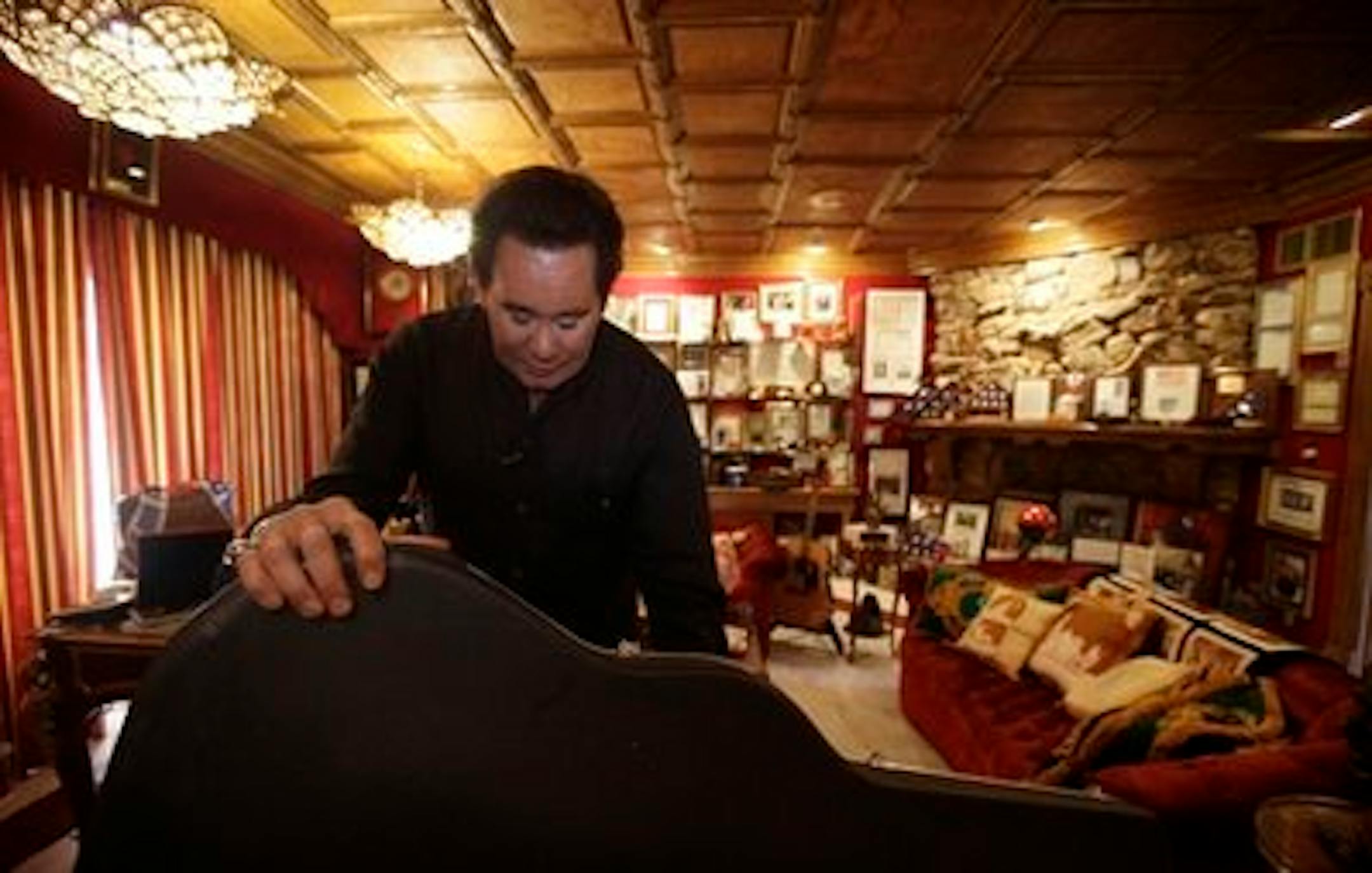 FILE - In this Friday, Nov. 12, 2010 file photo, Wayne Newton shows some of the memorabilia in the Red Room during an interview at his home in Las Vegas. Newton said Tuesday Oct. 18, 2011 plans to open his sprawling Casa de Shenandoah estate in Las Vegas for public tours are almost complete. (AP Photo/Julie Jacobson)
