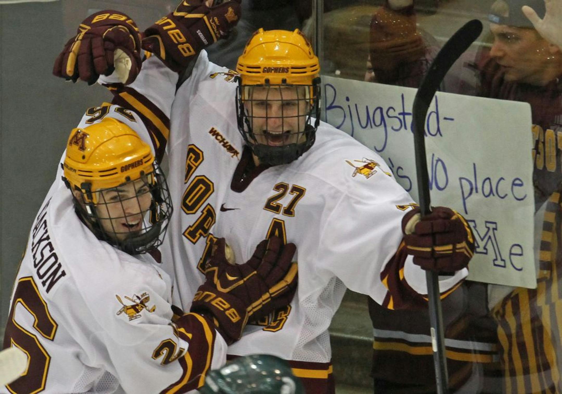 Christian Isackson celebrated with Nick Bjugstad after Bjugstad scored a first period goal.
