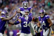 Andrew Sendejo celebrated with teammates after an interception against Tampa Bay.