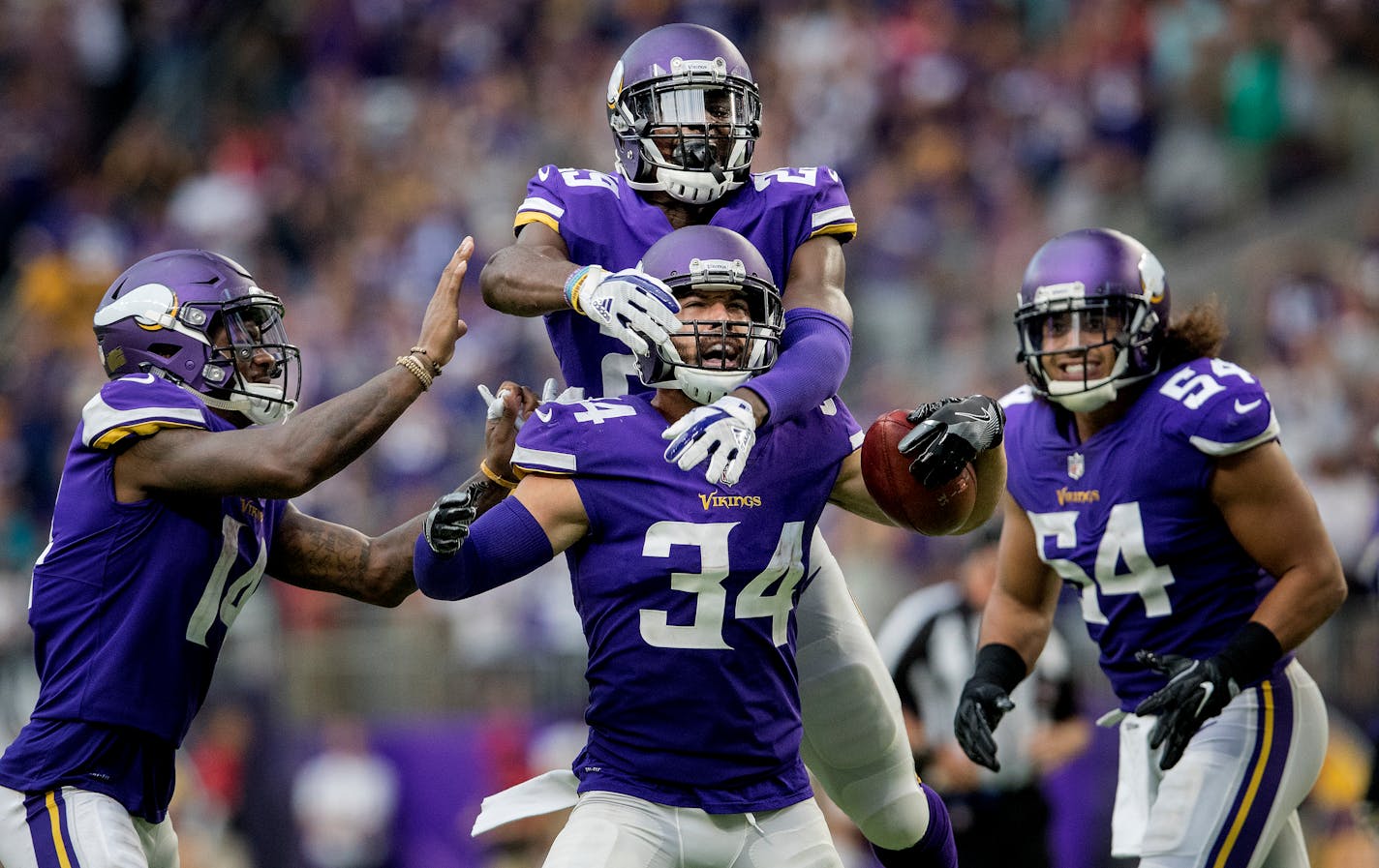 Andrew Sendejo celebrated with teammates after an interception against Tampa Bay.