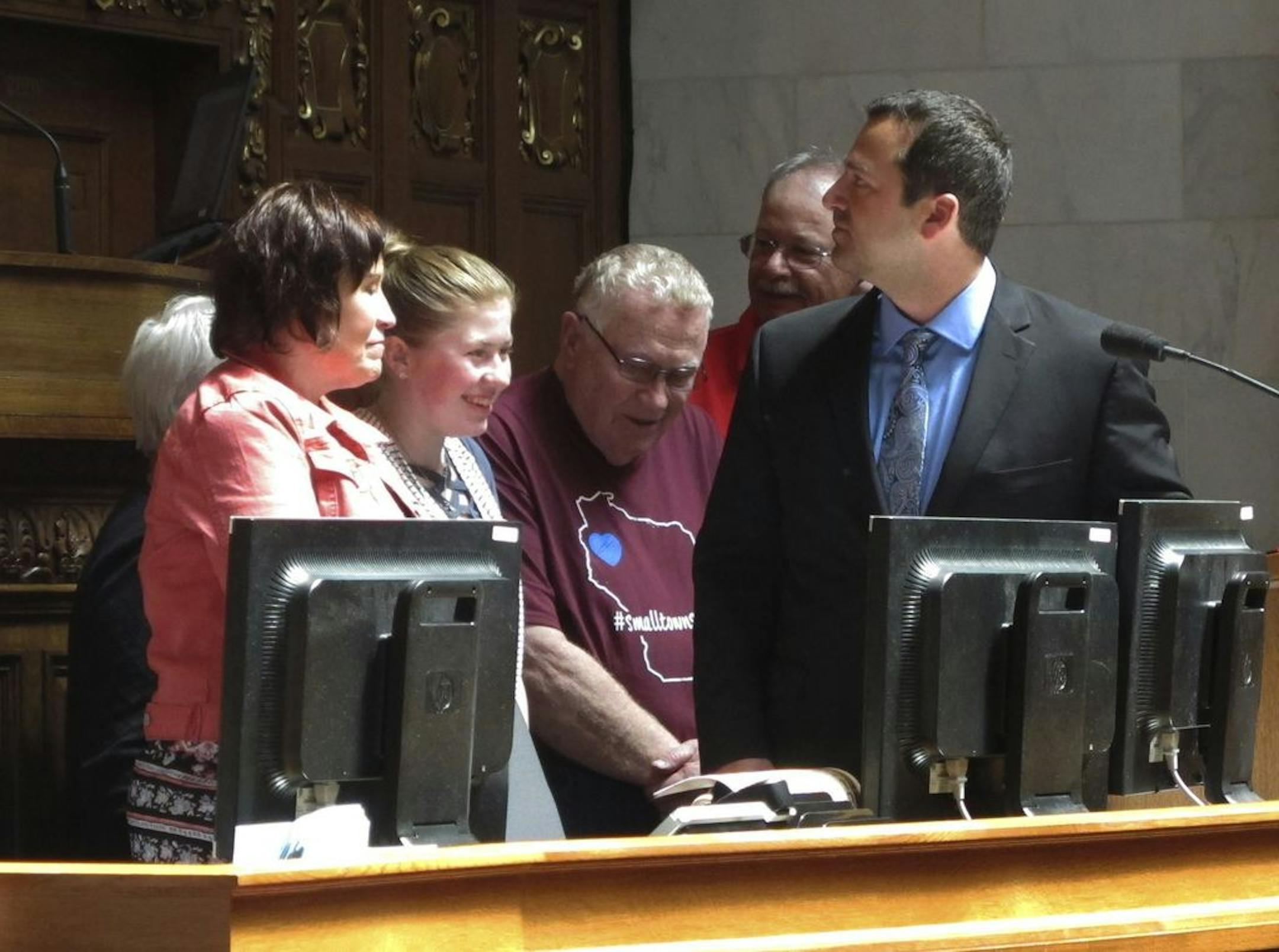 Kidnapping victim Jayme Closs, second from left, appears with her family and supporters to receive a "hometown hero" award from the Wisconsin Assembly on Wednesday, May 15, 2019, in Madison, Wis. Closs escaped in January after her parents were killed and she was held captive for three months in a remote cabin.