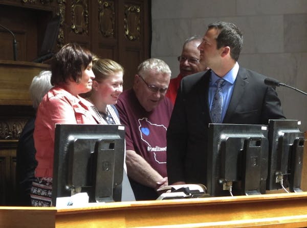 Kidnapping victim Jayme Closs, second from left, appears with her family and supporters to receive a "hometown hero" award from the Wisconsin Assembly