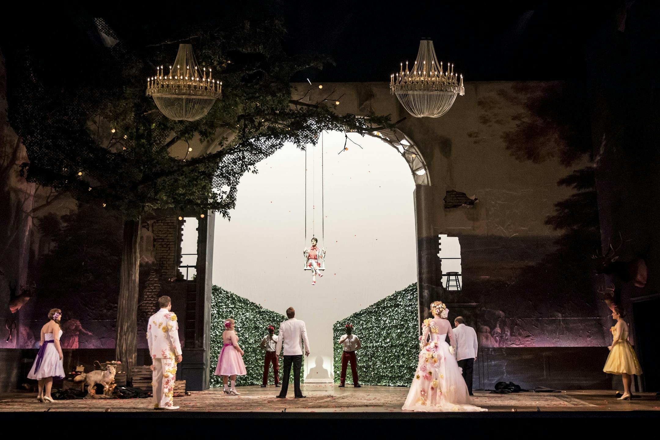 Adriana Zabala as Amore in a swing above the rest of the cast in the Minnesota Opera production of "Diana's Garden."