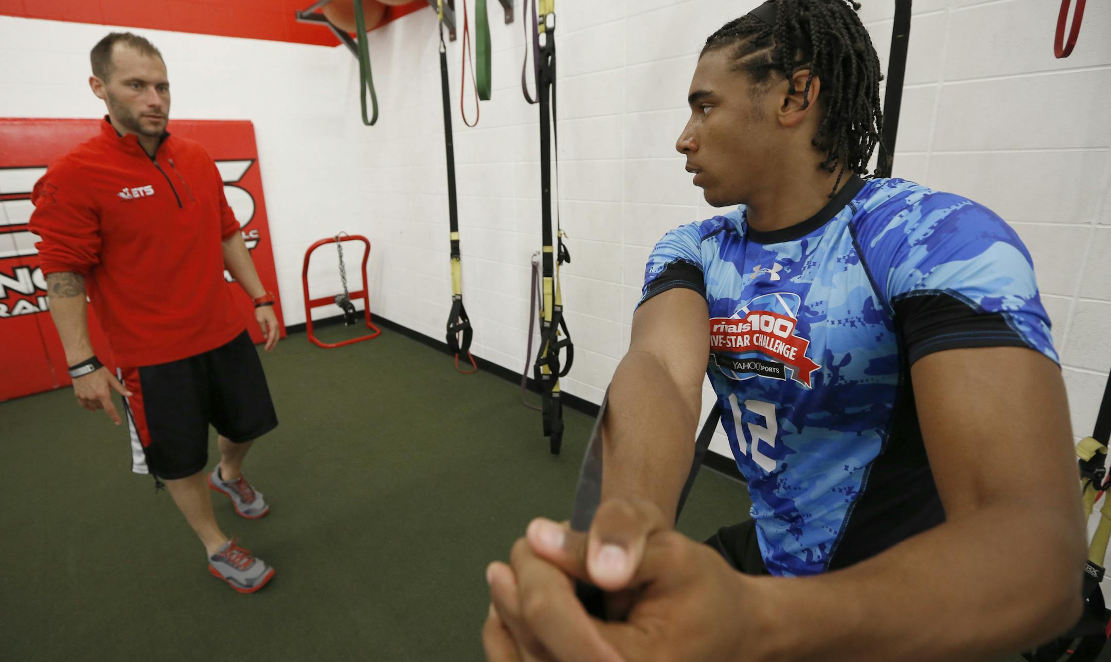 (left to right) Trainer Ryan Engelbert worked with prep athlete Seth Green at ETS Gym in Woodbury on 7/11/14.] Bruce Bisping/Star Tribune bbisping@startribune.com Ryan Engelbert, Seth Green/source.