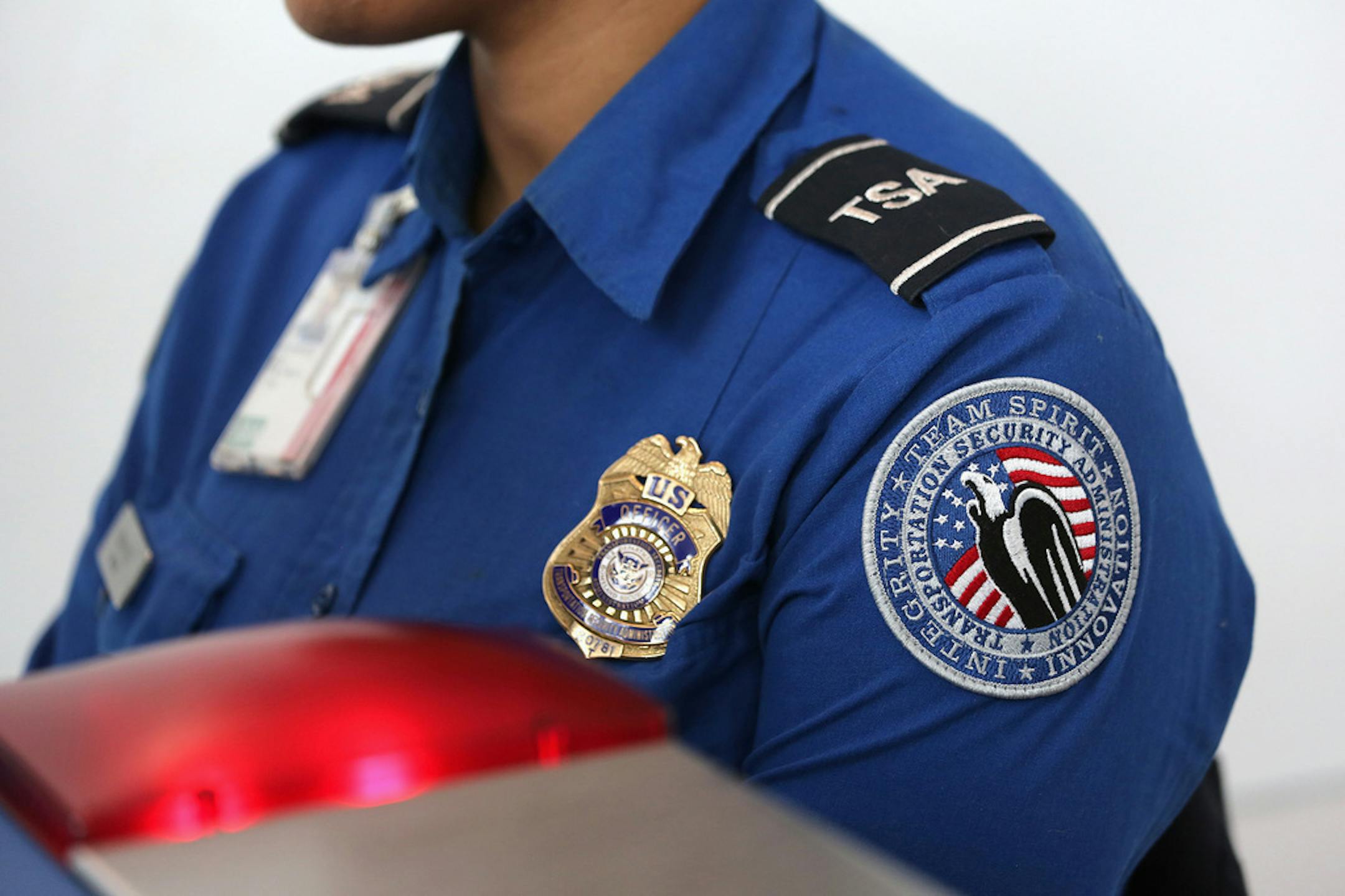 A TSA agent watches an X-ray monitor while screening luggage at a special TSA Pre-check lane at Terminal C of the LaGuardia Airport on Jan. 27, 2014 in New York. President Trump wants 400 TSA agents sent to the border to help with the migrant surge.