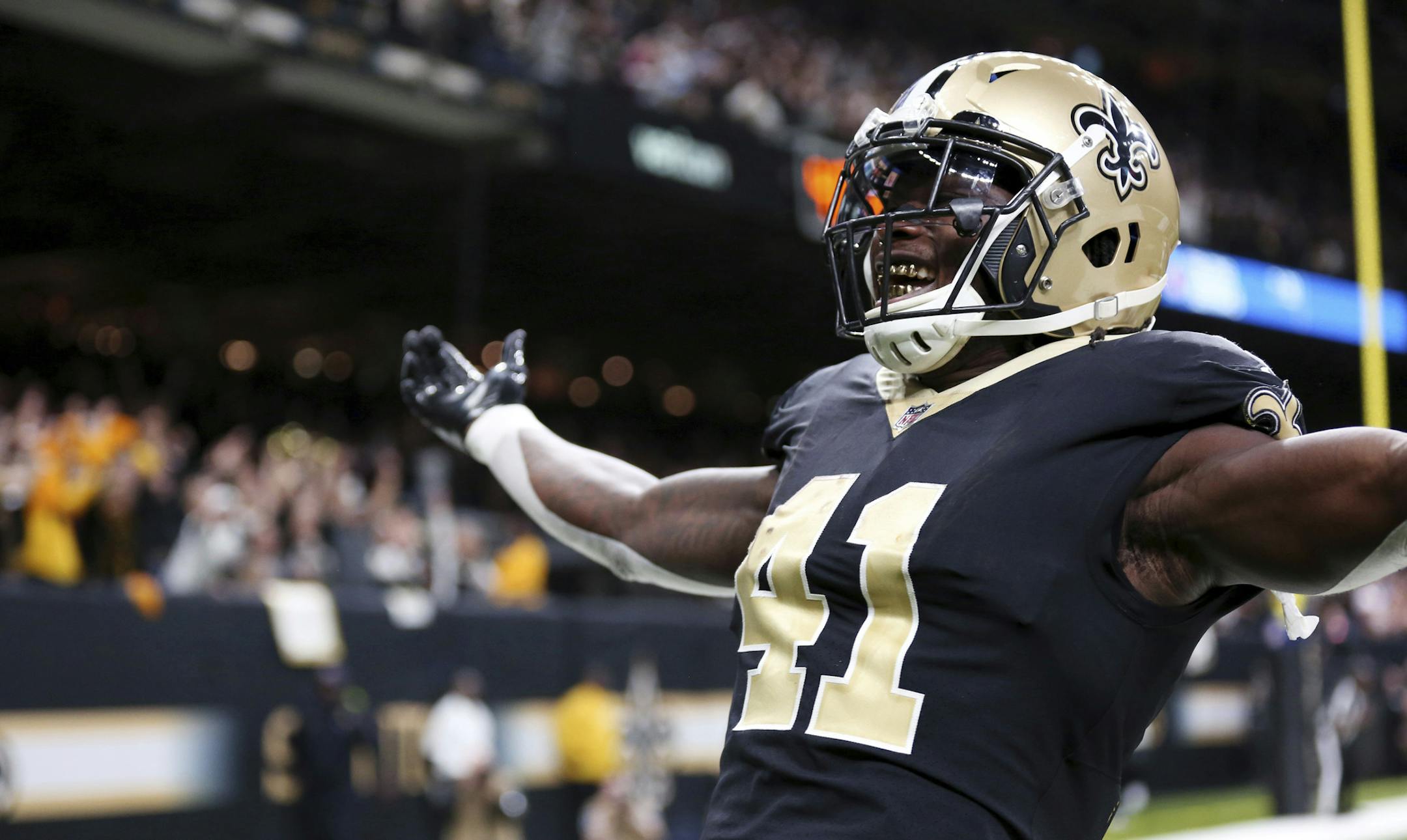 New Orleans Saints running back Alvin Kamara (41) celebrates his game-tying two-point conversion in the second half of an NFL football game against the Washington Redskins in New Orleans, Sunday, Nov. 19, 2017. The Saints won -34-31. (AP Photo/Rusty Costanza)