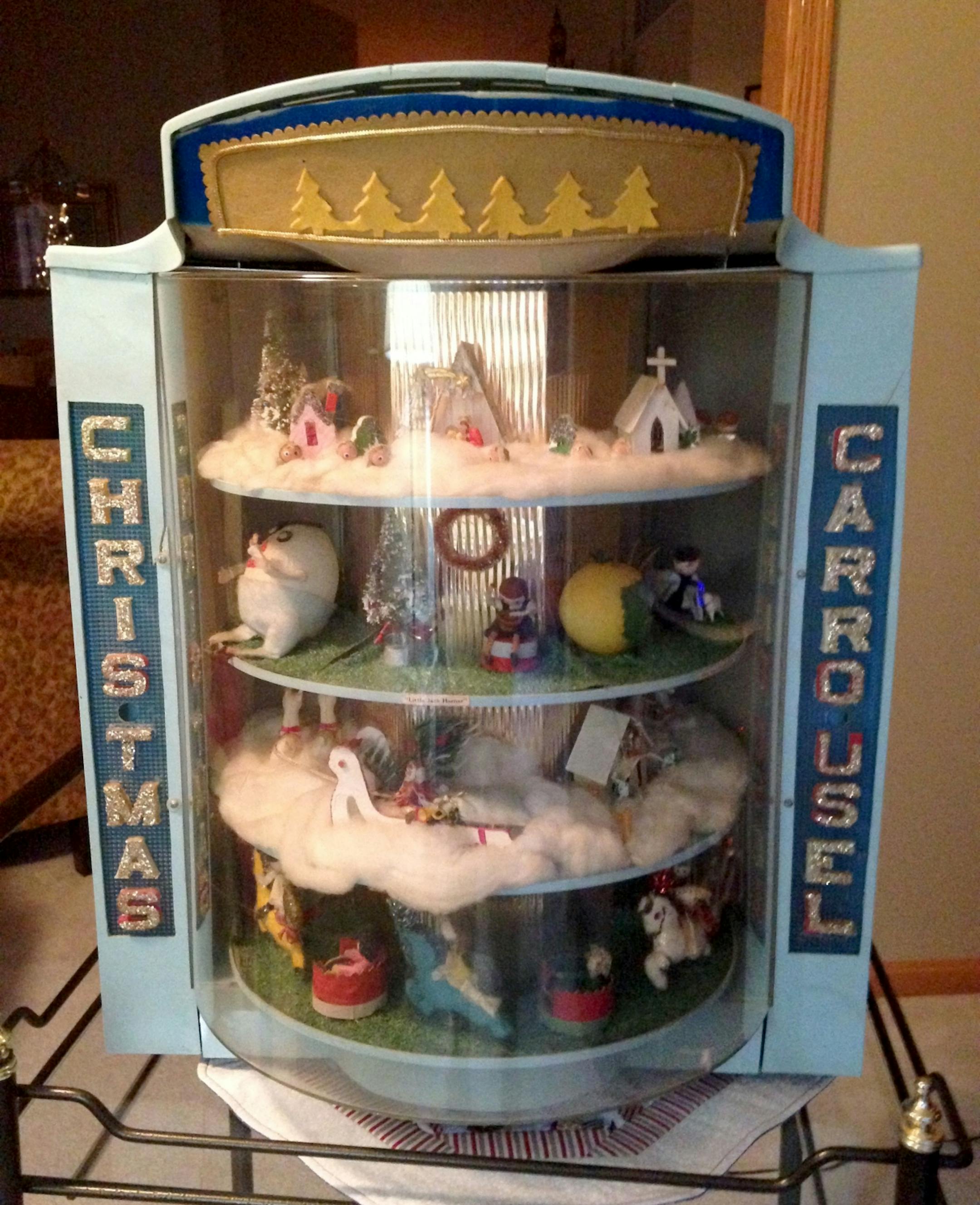 Joan Elstad's "Christmas Carousel," made from a Timex watch display by her mother 47 years ago for her two grandsons. The carousel lights up and rotates, and gas themed shelves.