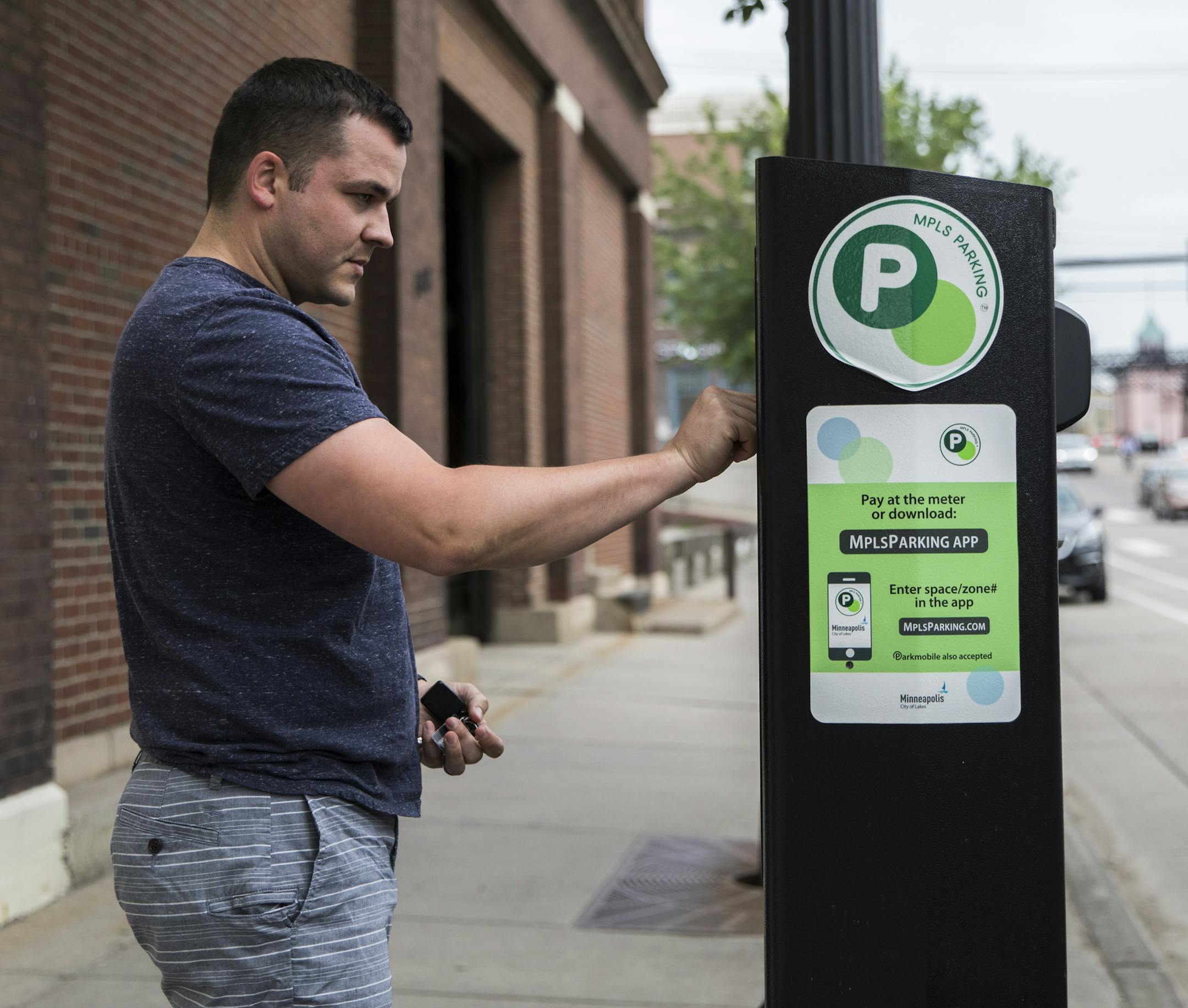 Jay Van Hoven paid for a meter on his way to dinner in the North Loop on June 21, 2018, in Minneapolis, Minn. The city of Minneapolis is increasing rates of parking meters in the North Loop and possibly in entire city. ] RENEE JONES SCHNEIDER • renee.jones@startribune.com