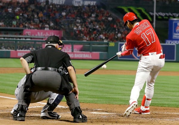 Los Angeles Angels' Shohei Ohtani, of Japan, hits an RBI-double against the Minnesota Twins during the third inning of a baseball game in Anaheim, Cal