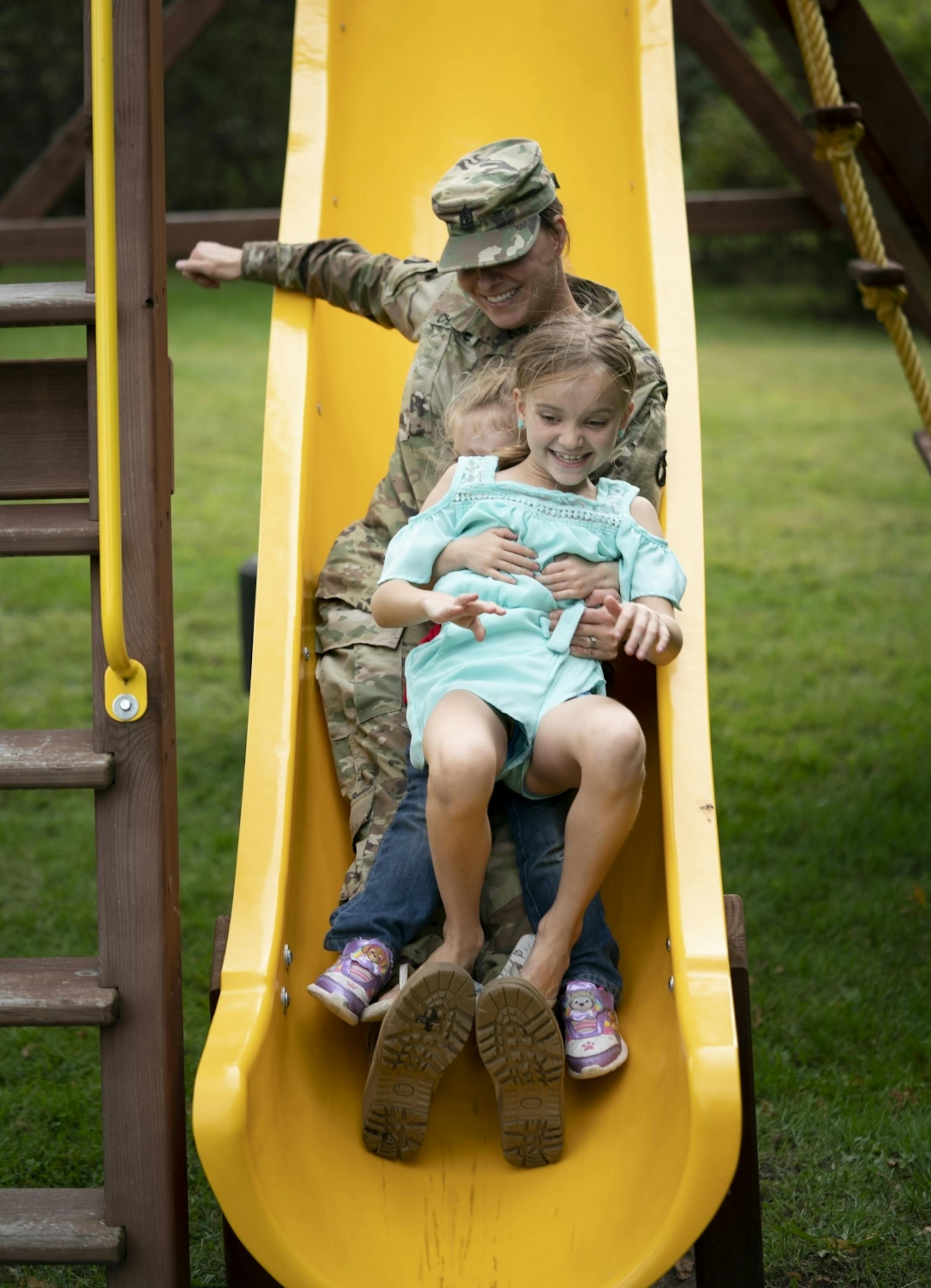 Jeanette Chafee rode down the slide with her daughters Madison, 8, and Ally, 3, on a swing-set at home in Scandia, Minn., on Wednesday, September 18, 2019.