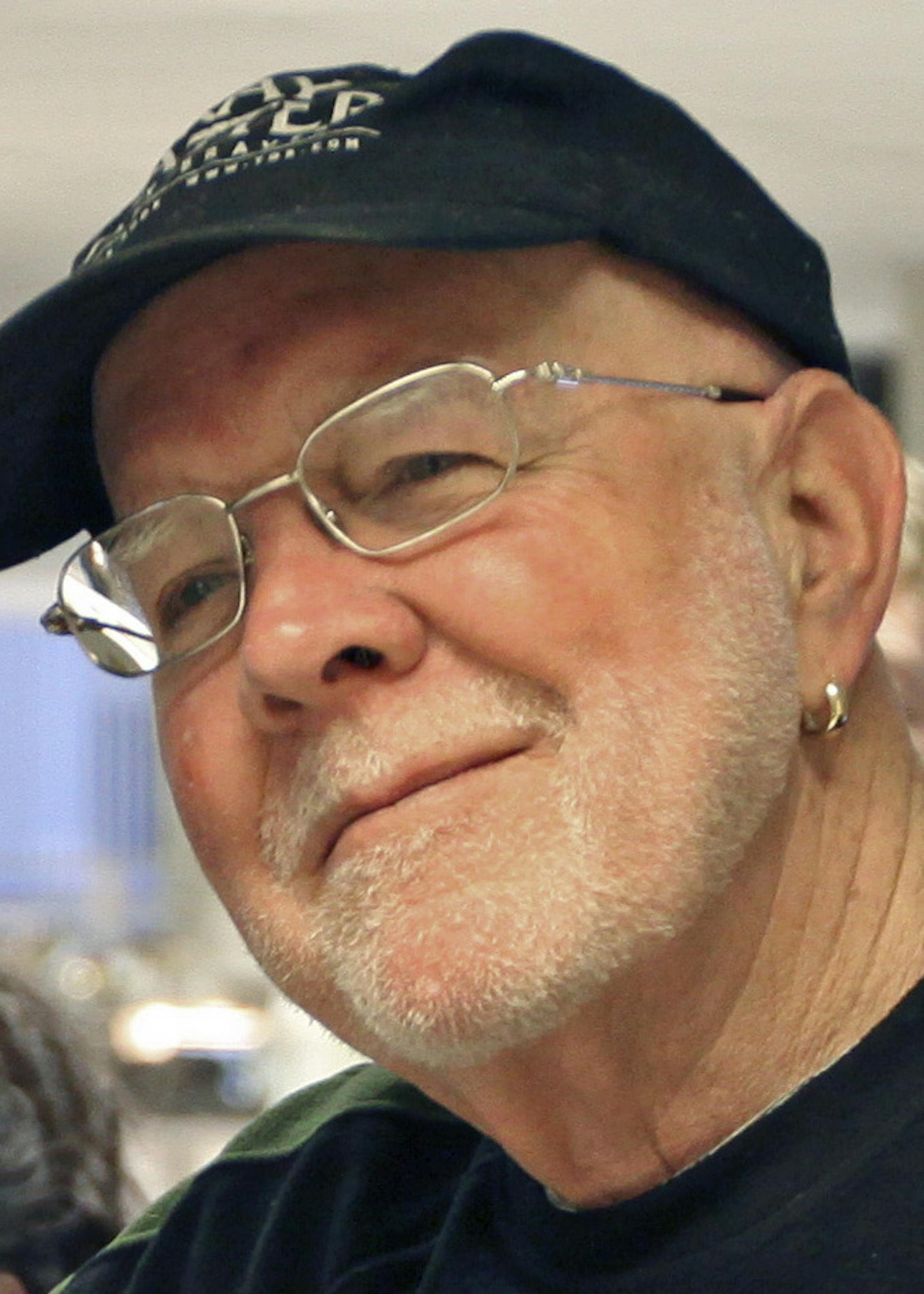 BRUCE BISPING ï bbisping@startribune.com Minneapolis, MN., Thursday, 1/8/2009] (right) Bud Armstrong listened to members of the sports department and the news room say good-by, during a department send-off of the long time Star Tribune employee.