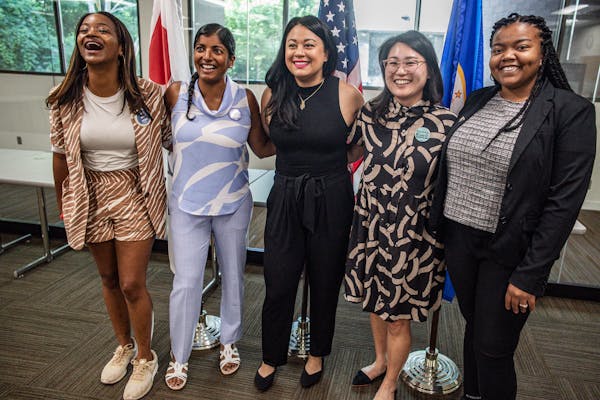 From left to right, Anika Bowie, Saura Jost, Mitra Jalali, Hwa Jeong Kim and Cheniqua Johnson posed after filing together in August to run for the St.