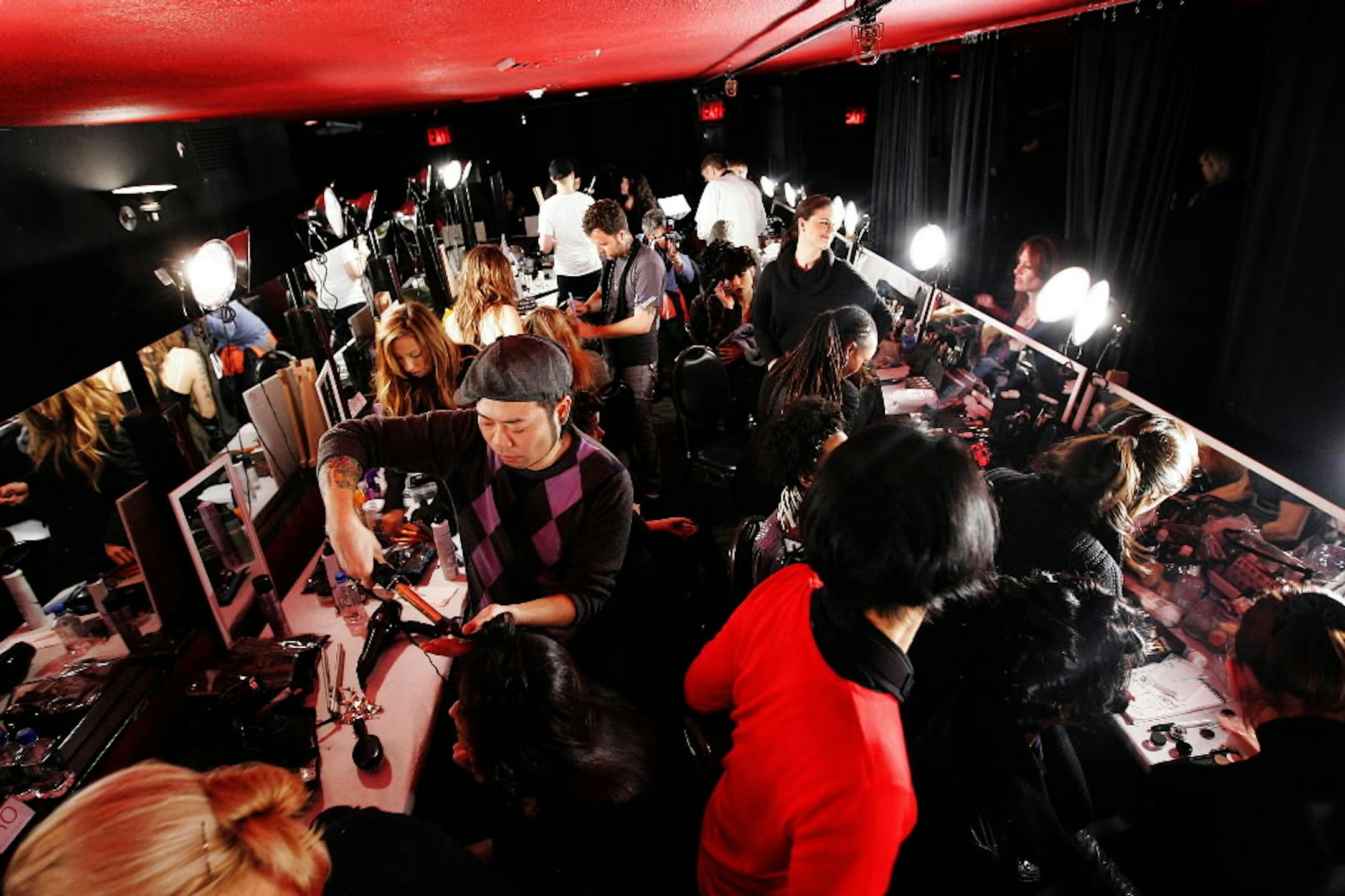 Models, make-up artists and others jam the backstage area before the fall 2008 collection of Baby Phat show during Fashion Week in New York Saturday.