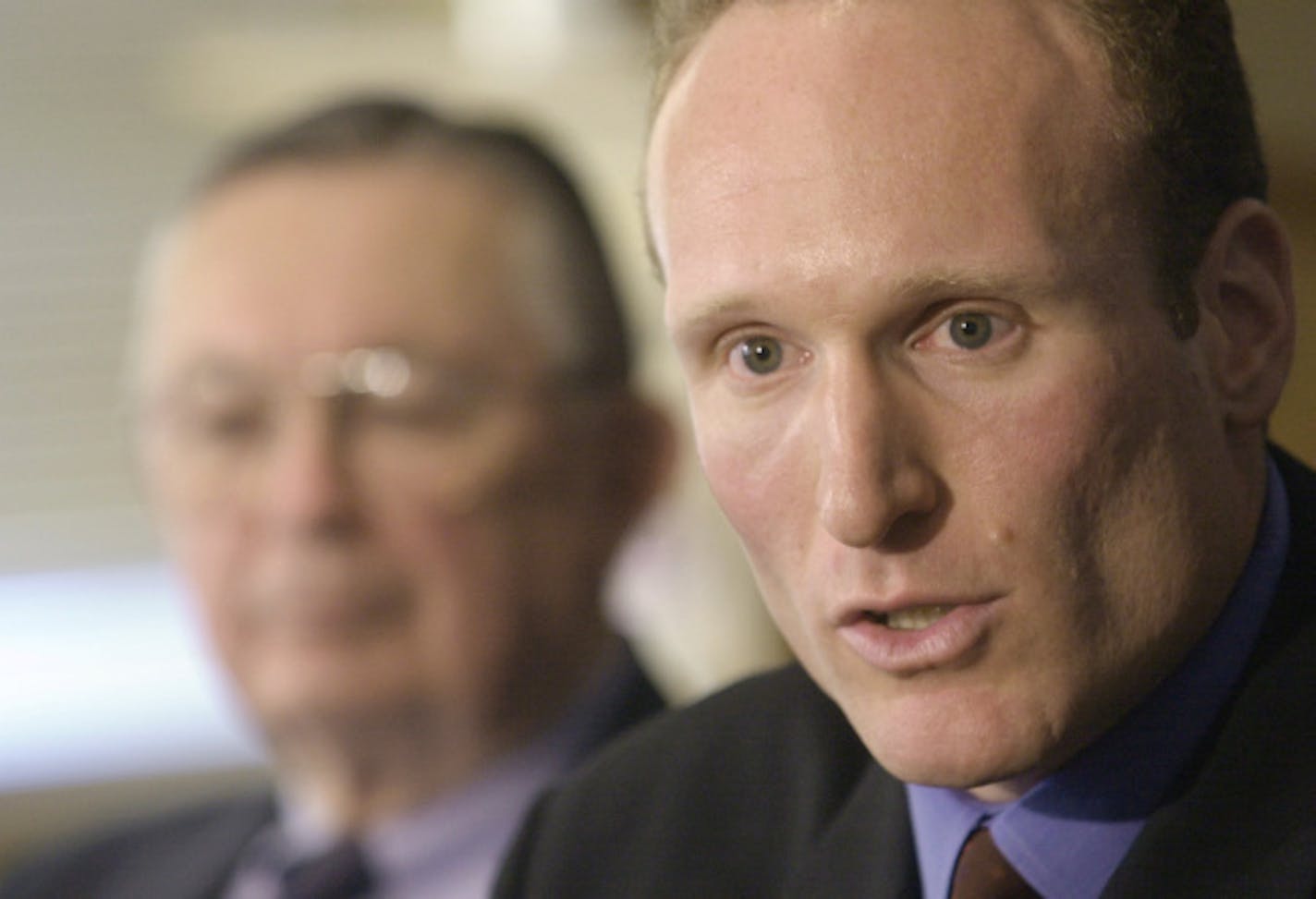 Cleveland Indians general manager Mark Shapiro, right, answers questions during a news-conference Wednesday, Oct. 24, 2001, in Cleveland. Cleveland's general manager, who has rebuilt the mid-market Indians into a contender without having much money to spend, received a two-year contract extension Wednesday, Dec. 22, 2004, through the 2007 season. Seated on the left is Indians owner Larry Dolan.