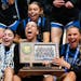 Minnetonka senior guard Tori McKinney screams in joy while holding the Class 4A championship trophy Saturday after the Skippers beat Hopkins 64-56 for