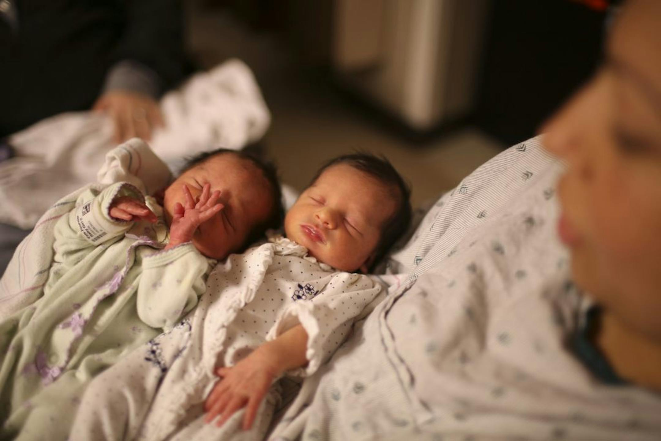 Twin girls who were born prematurely in 2013 at the Mother Baby Center at Children's Hospital in Minneapolis. Minnesota's 2013 preterm births were detailed in a new March of Dimes report.
