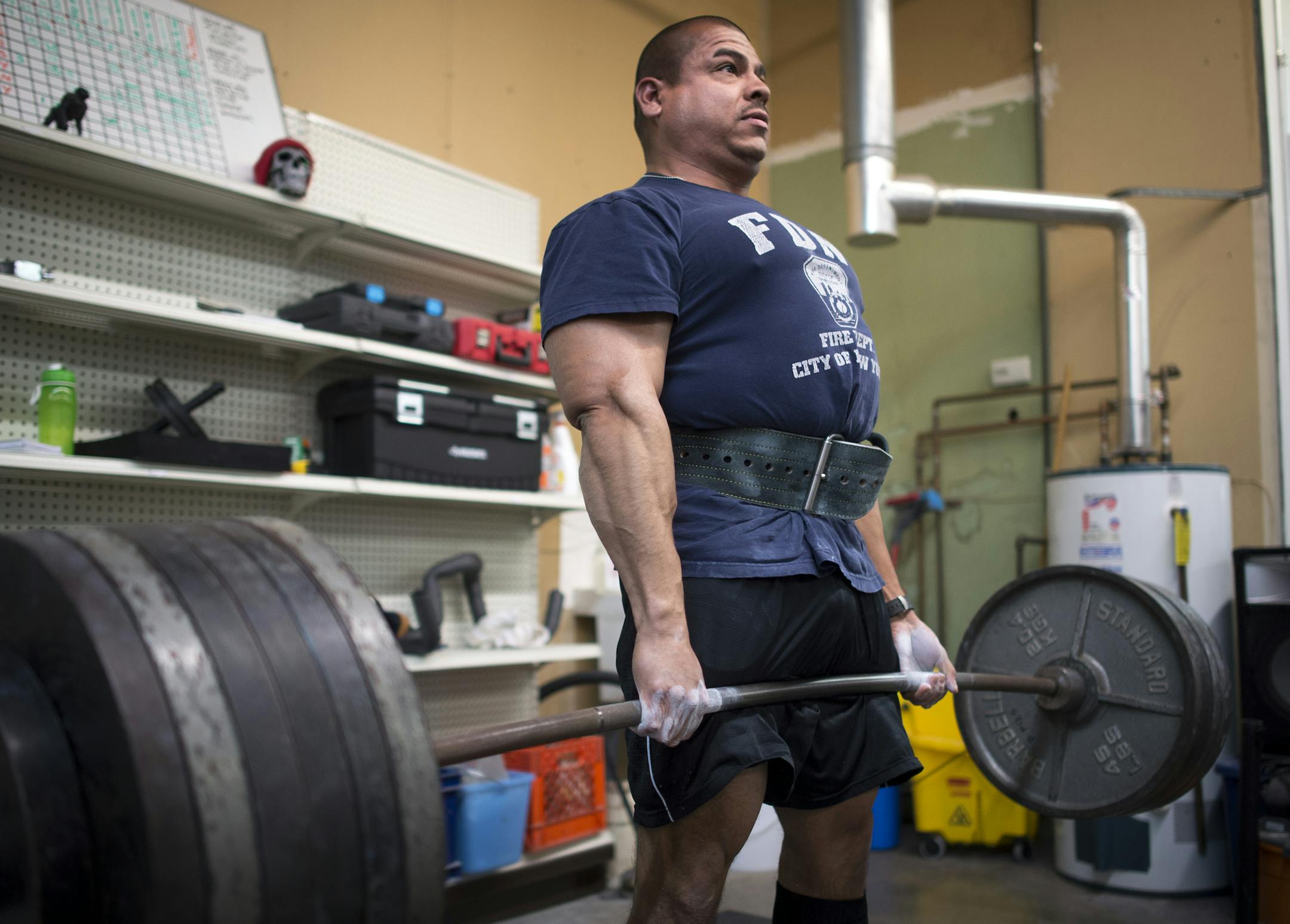 Val Huerta, a firefighter paramedic from Woodbury, deadlifts 645 pounds while training for the Relentless powerlifting competition last Thursday. ] (Aaron Lavinsky | StarTribune) Feature on the quirky sport of powerlifting and the often crazy-looking but reasonably normal people who do it. Powerlifters were photographed in training on Thursday, March 19, 2015 at Twin City Barbell in Eagan.