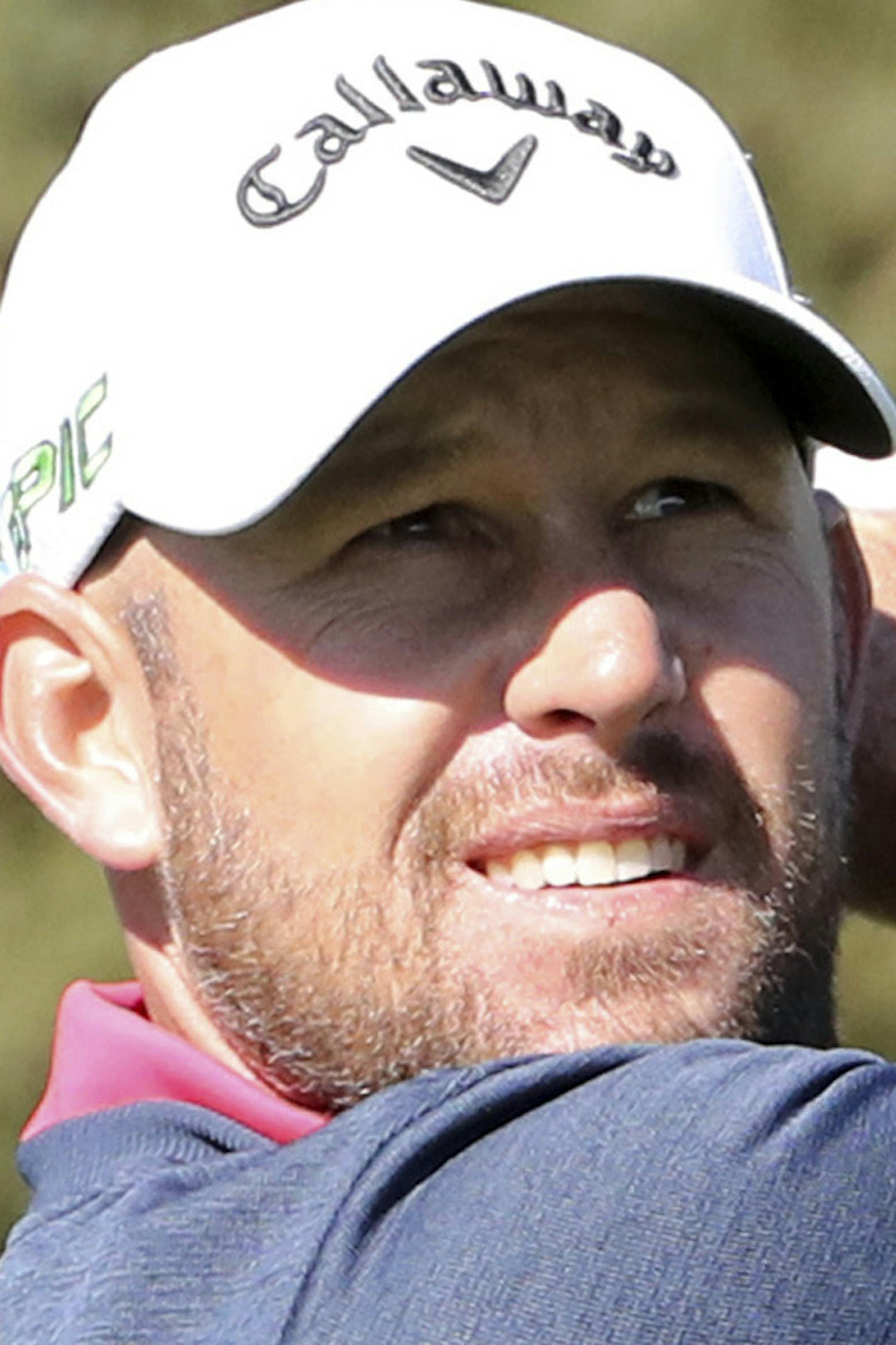 Scott Brown of the United States watches his shot on the third hole during the third round of the CJ Cup golf tournament at Nine Bridges on Jeju Island, South Korea, Saturday, Oct. 21, 2017. (Ko Bum Joon/Newsis via AP) ORG XMIT: SEL806
