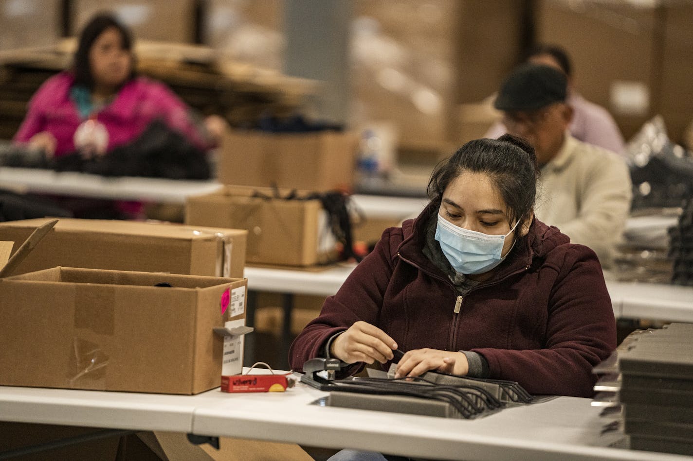 Perla Hernandez helps assemble a face shield, most likely headed to a health care worker.] John Schwanke's family-owned manufacturing business in Carver, Lakeview Industries, has 85 employees and makes made-to-order components out of plastic, rubber and foam. But when the state started to shut down in March due to the virus.RICHARD TSONG-TAATARII ¥ richard.tsong-taatarii@startribune.com